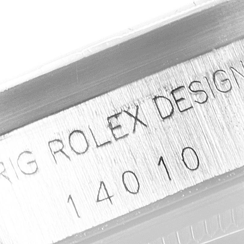 The image shows an up-close view of the serial number engraving on the side of a Rolex Air-King 14010 Men's Stainless Steel Silver Dial 14010 Men's Stainless Steel Silver Dial watch case.