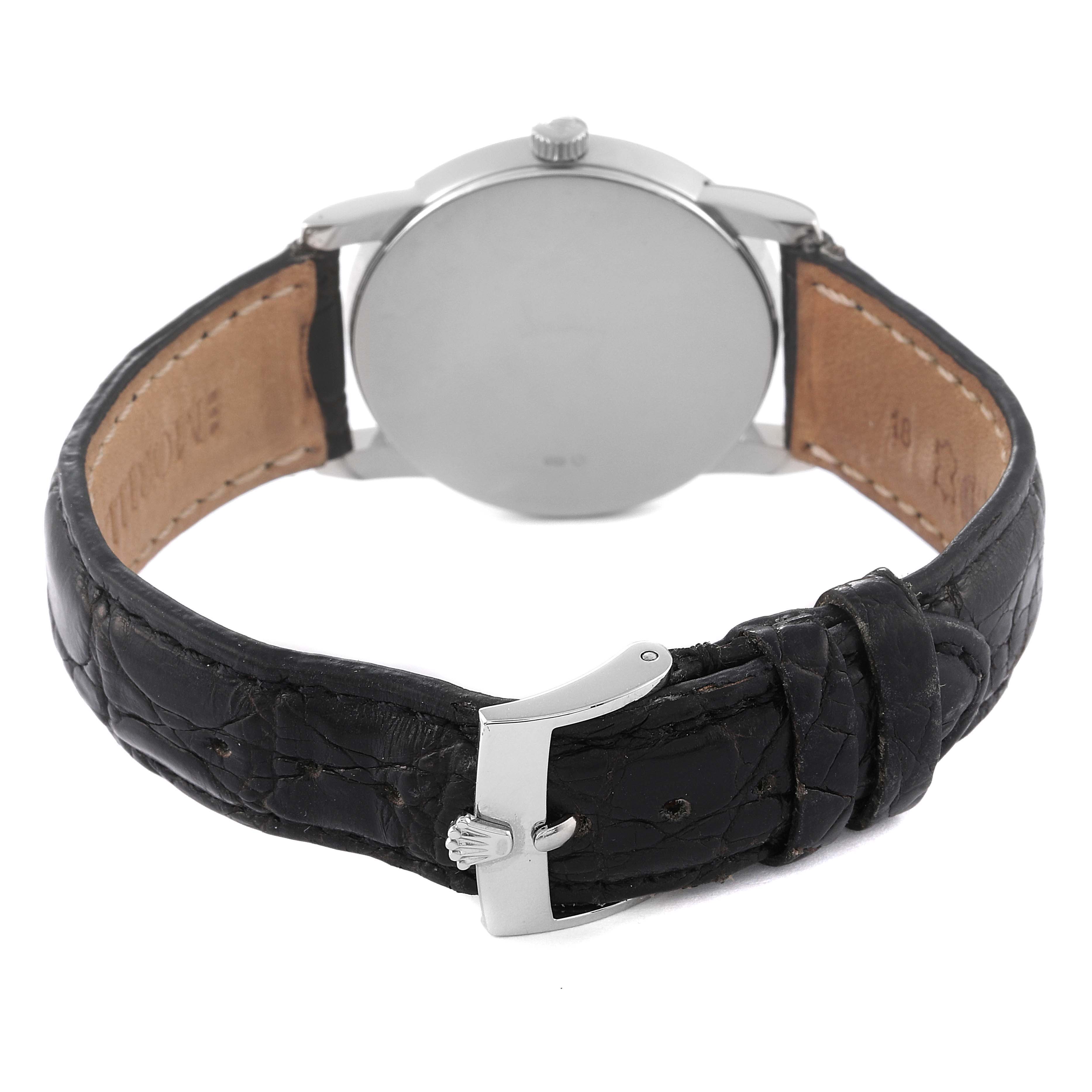 The image shows the back angle of a Rolex Cellini 5116/9 Men's White Gold Grey Dial 5116/9 Men's White Gold Grey Dial watch, highlighting its leather strap and clasp.