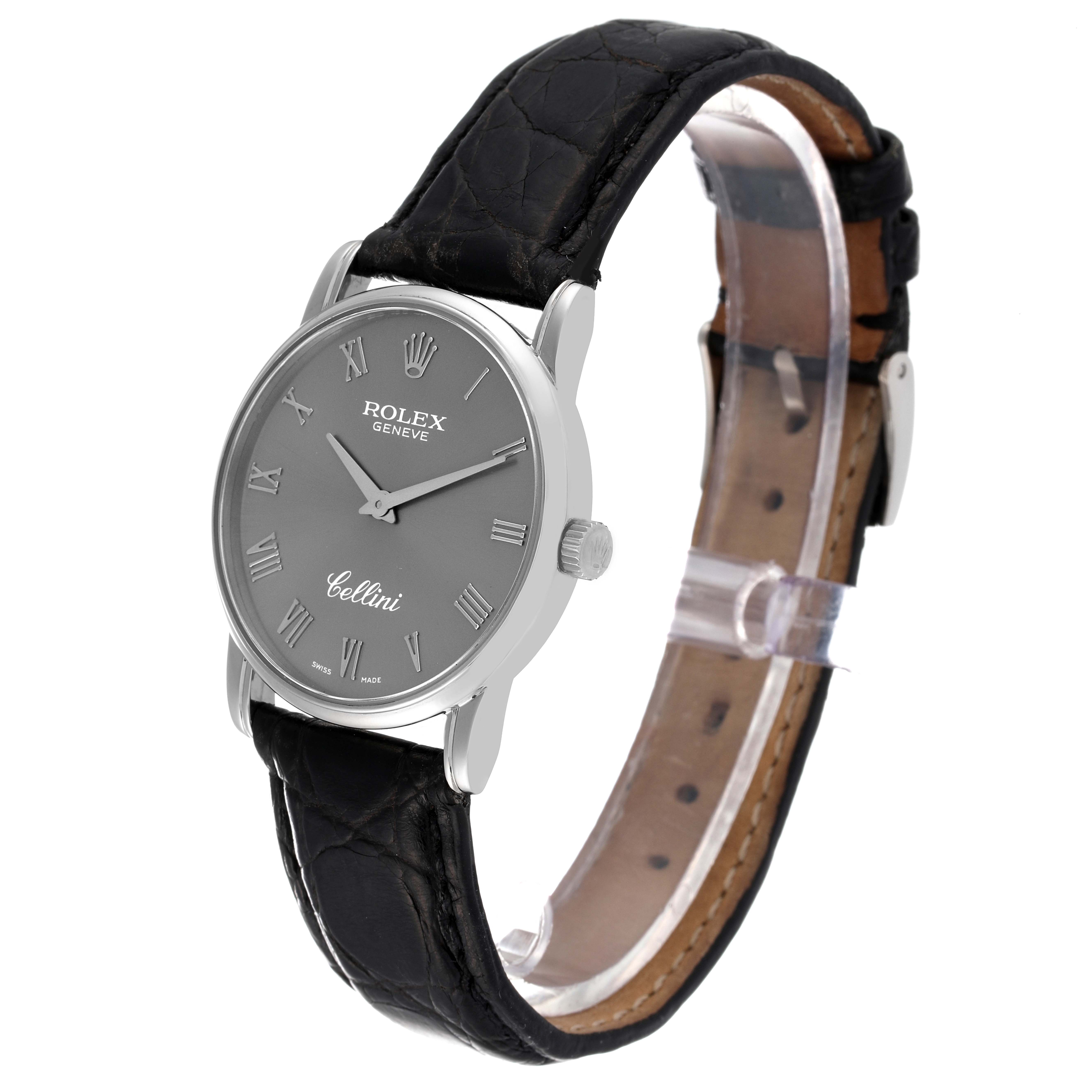 The Rolex Cellini 5116/9 Men's White Gold Grey Dial 5116/9 Men's White Gold Grey Dial watch is shown at an angle displaying the face, bezel, crown, lugs, and leather strap.