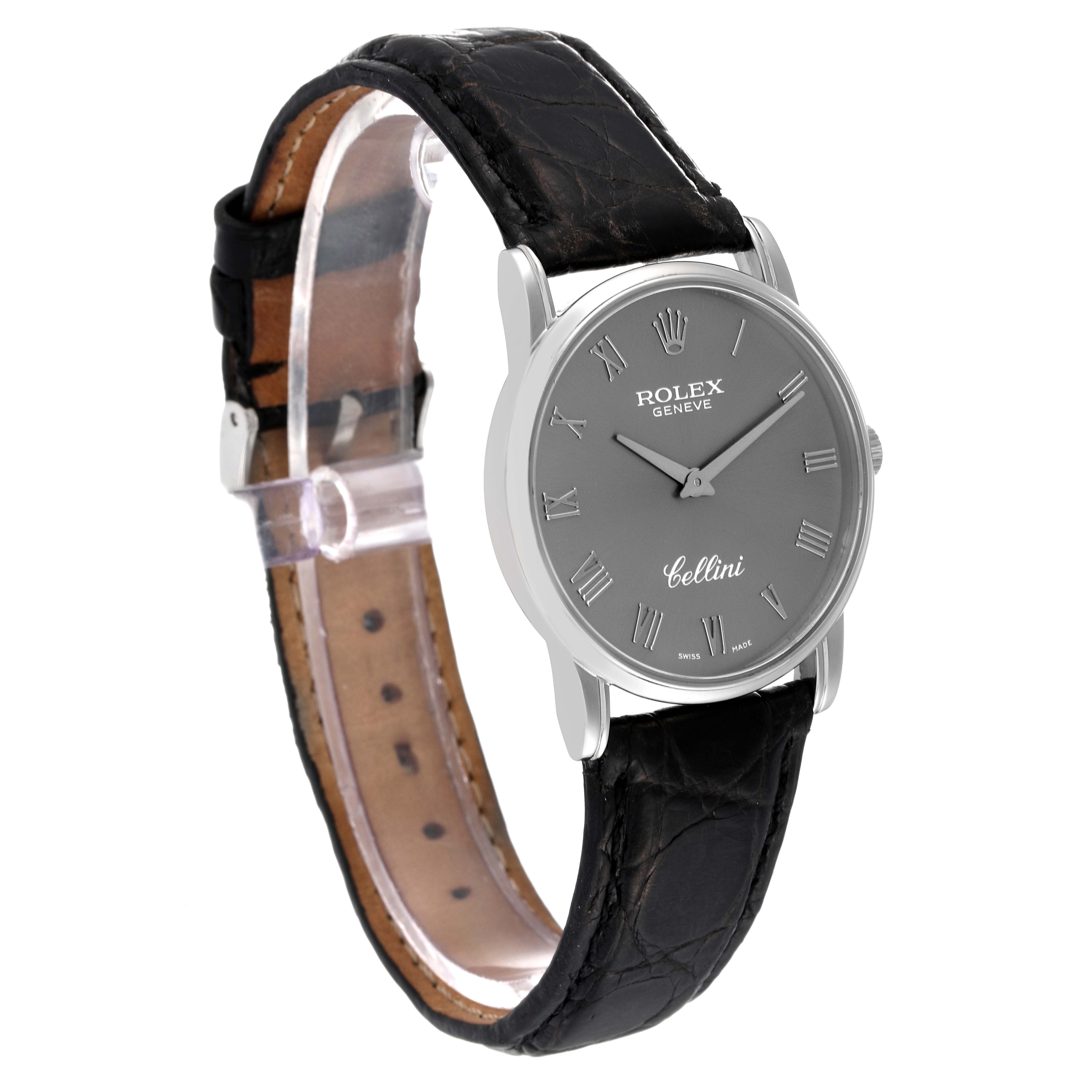 The Rolex Cellini 5116/9 Men's White Gold Grey Dial 5116/9 Men's White Gold Grey Dial watch is shown at a slight angle, displaying its face, crown, and black leather strap.