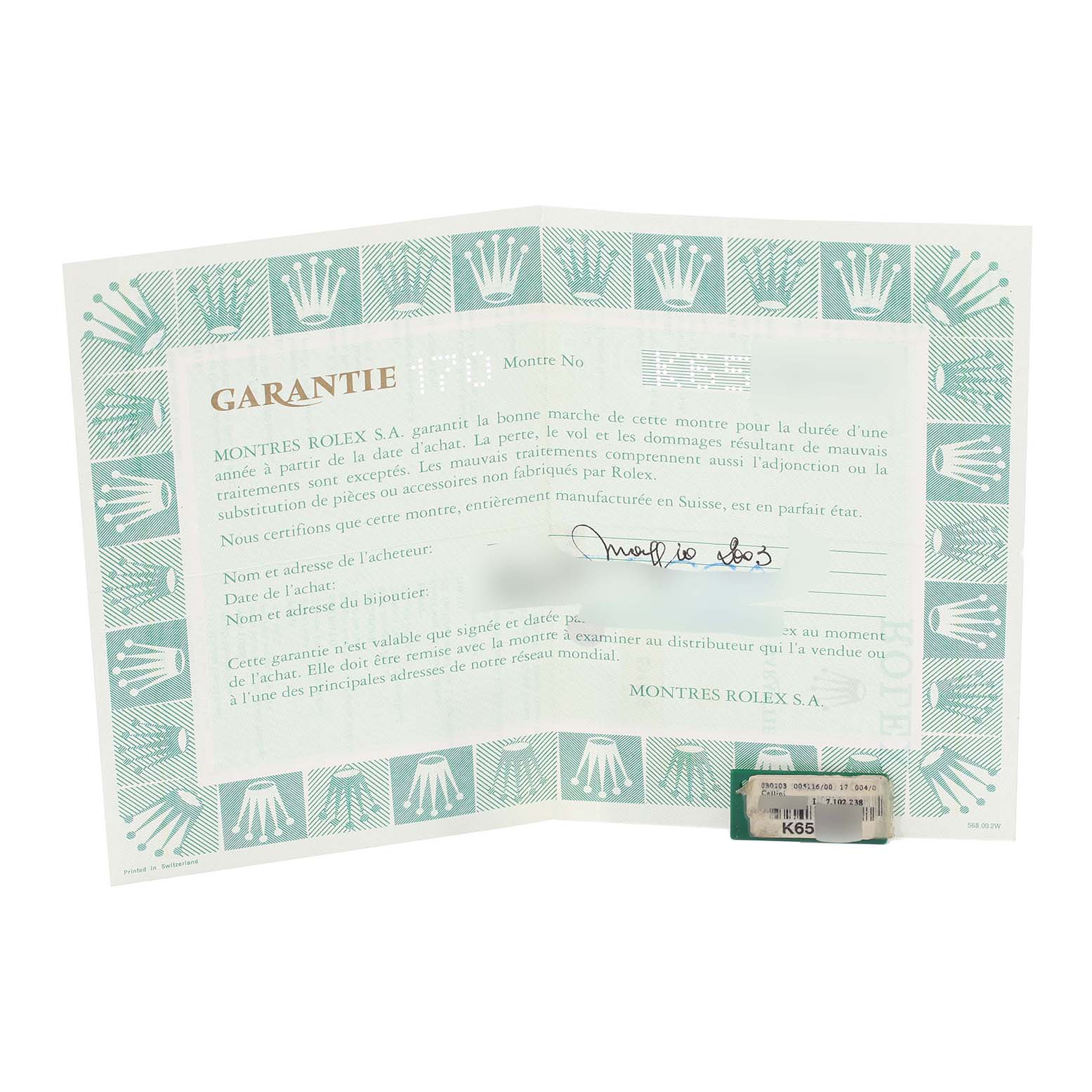 The image shows a guarantee document and a tag for a Rolex Cellini 5116/9 Men's White Gold Grey Dial 5116/9 Men's White Gold Grey Dial watch, viewed from a top-down perspective.