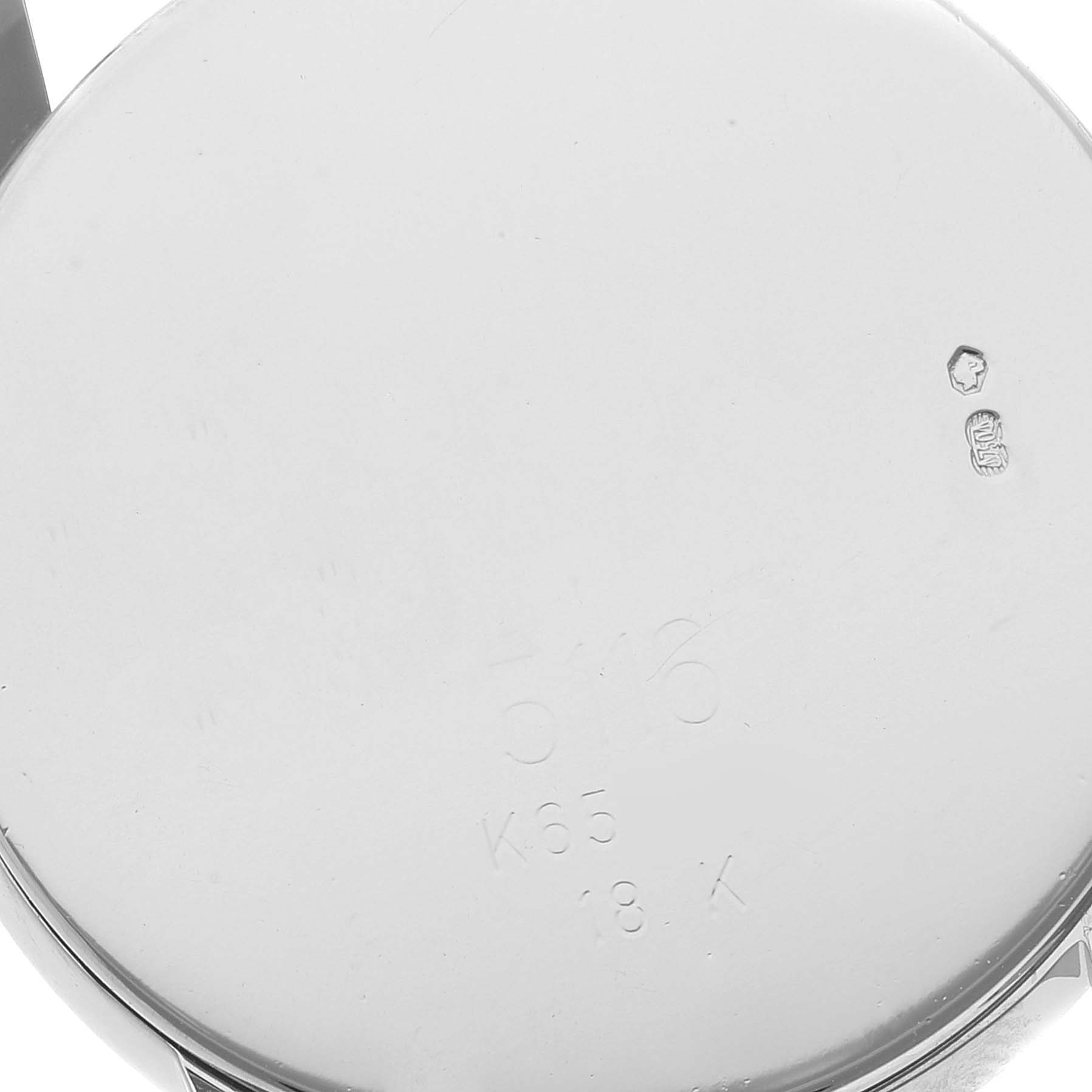 The image shows the back case of a Rolex Cellini 5116/9 Men's White Gold Grey Dial 5116/9 Men's White Gold Grey Dial watch at a close-up angle, highlighting the inscriptions and hallmarks on the back.