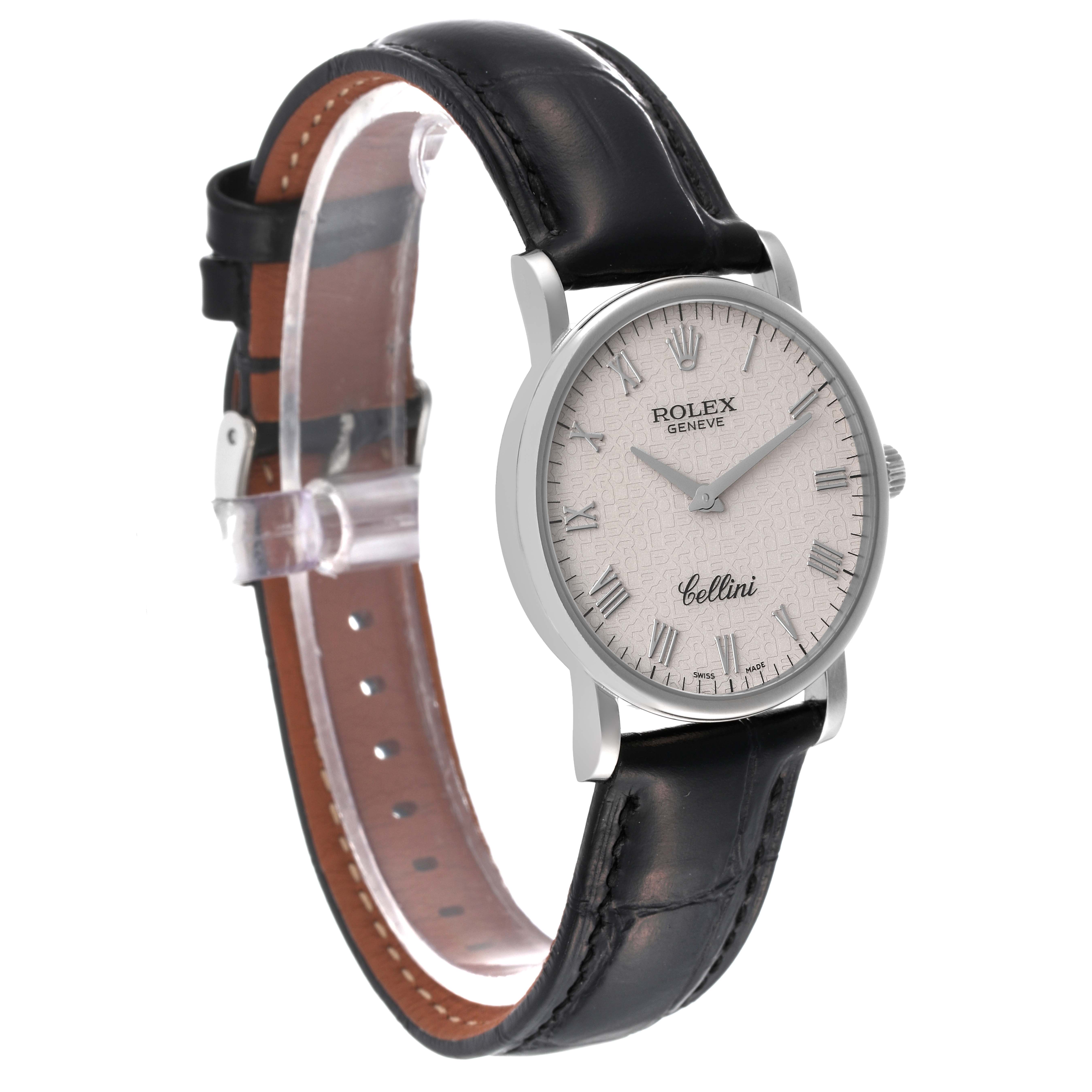 This Rolex Cellini 5115/9 Men's White Gold Beige Dial 5115/9 Men's White Gold Beige Dial watch is shown at a slightly tilted angle, displaying its white dial, Roman numerals, and black leather strap.
