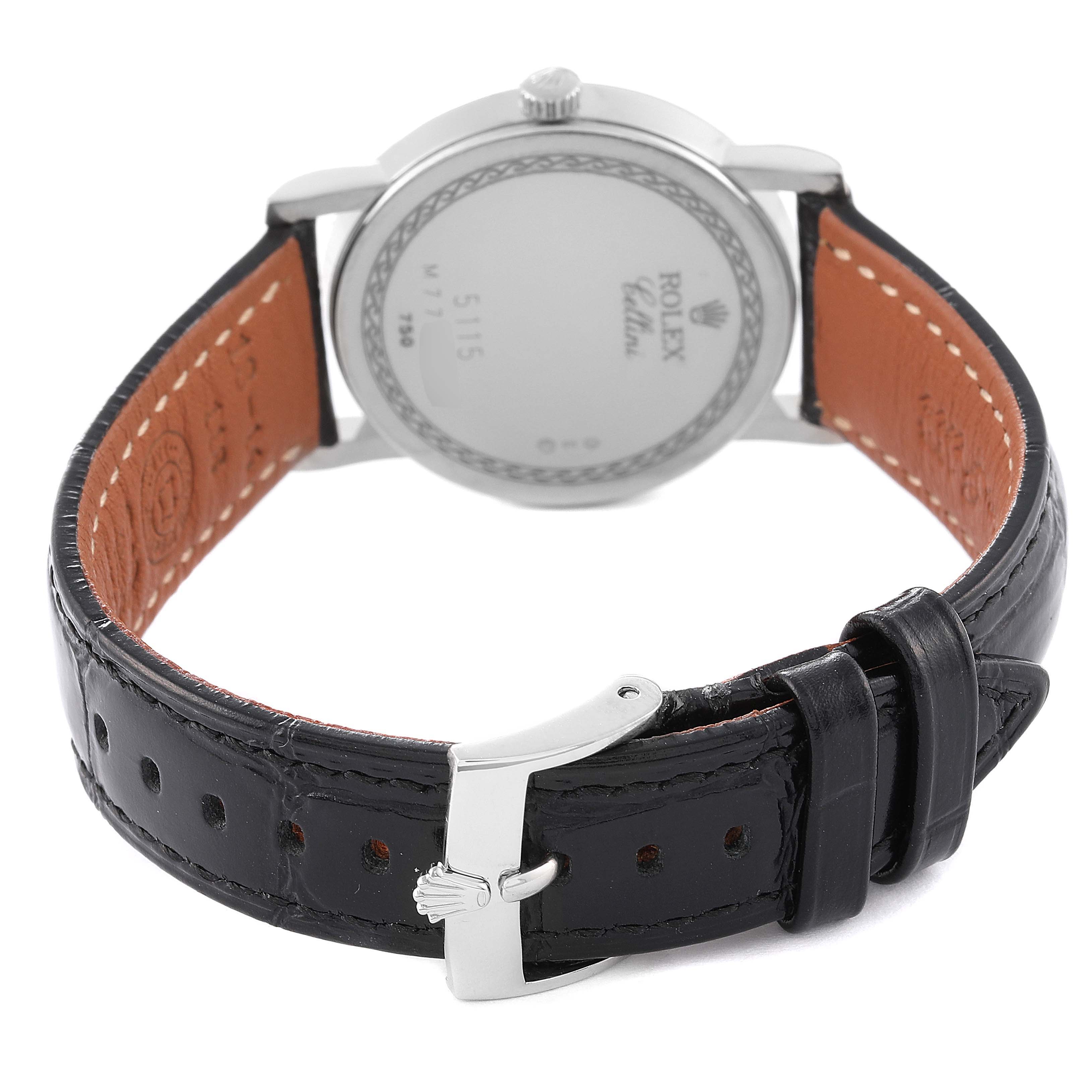 This image shows the back of a Rolex Cellini 5115/9 Men's White Gold Beige Dial 5115/9 Men's White Gold Beige Dial watch, highlighting the case back and black leather strap with a clasp.