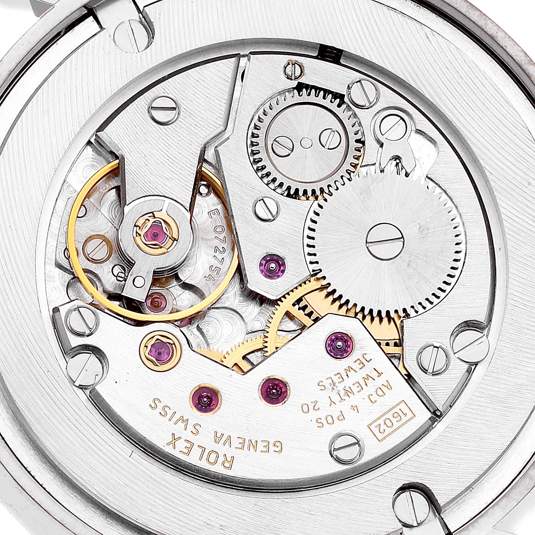 This image shows a close-up of the internal movement mechanism of a Rolex Cellini 5115/9 Men's White Gold Beige Dial 5115/9 Men's White Gold Beige Dial watch, highlighting gears and components.