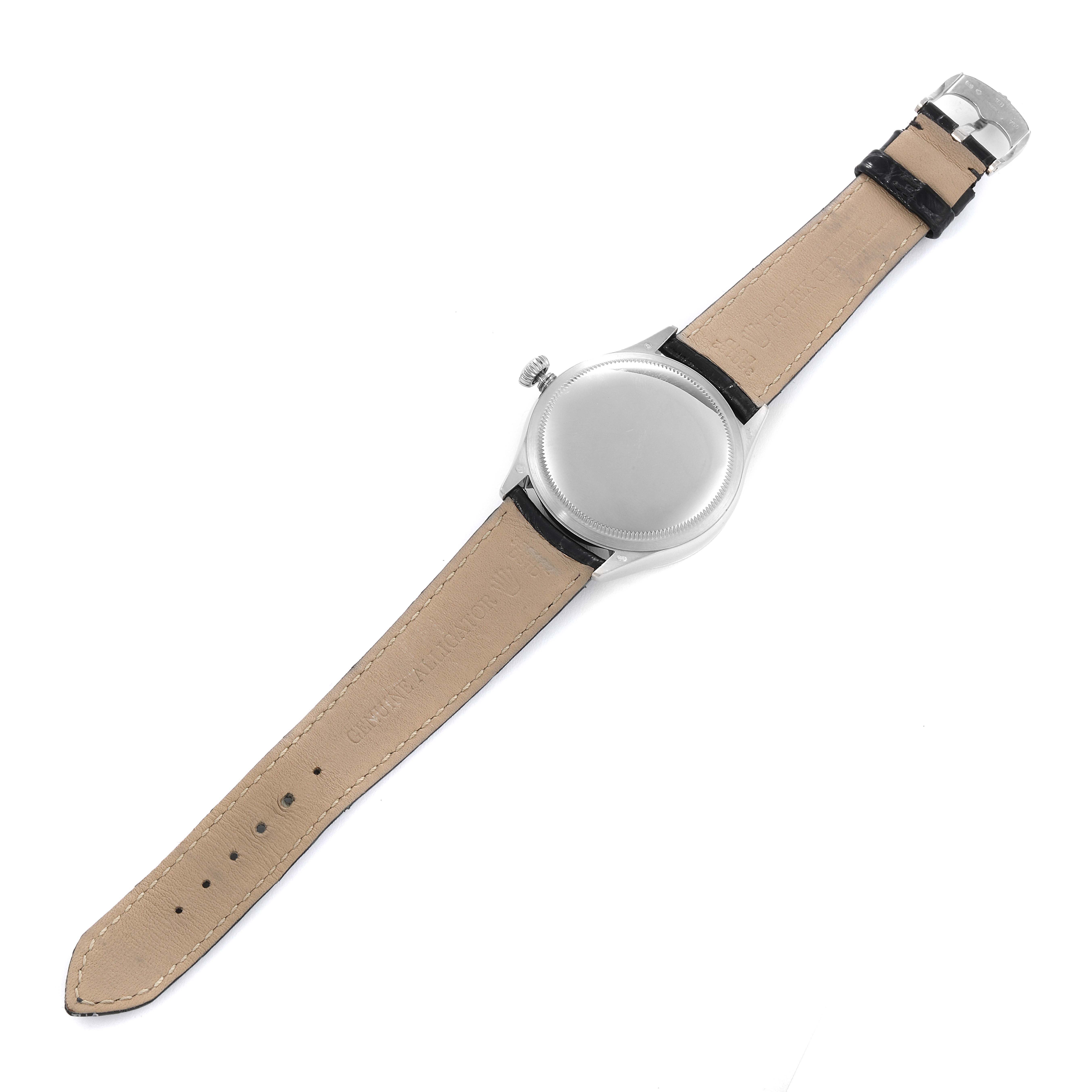 The image shows the back view of a Rolex Cellini 50519 Men
s White Gold Silver Dial 50519 Men
s White Gold Silver Dial watch, including the case back and the beige leather strap.