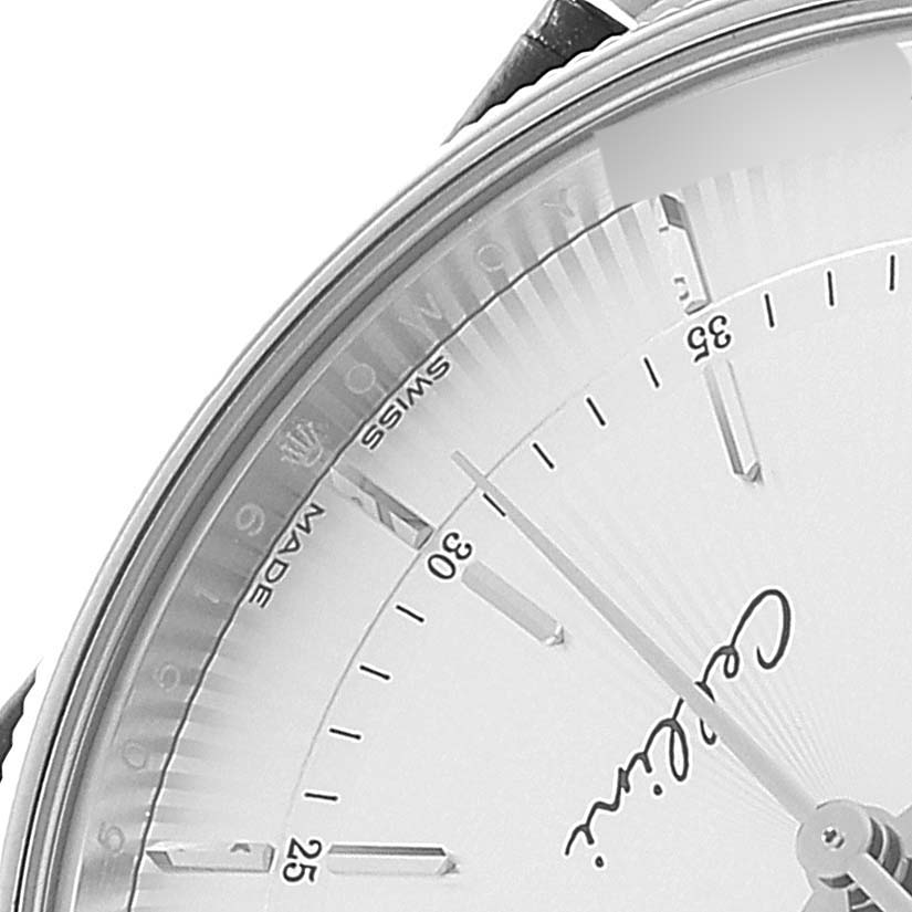The image shows a close-up of the upper left part of the Rolex Cellini 50519 Men
s White Gold Silver Dial 50519 Men
s White Gold Silver Dial watch face, including part of the dial and markers.