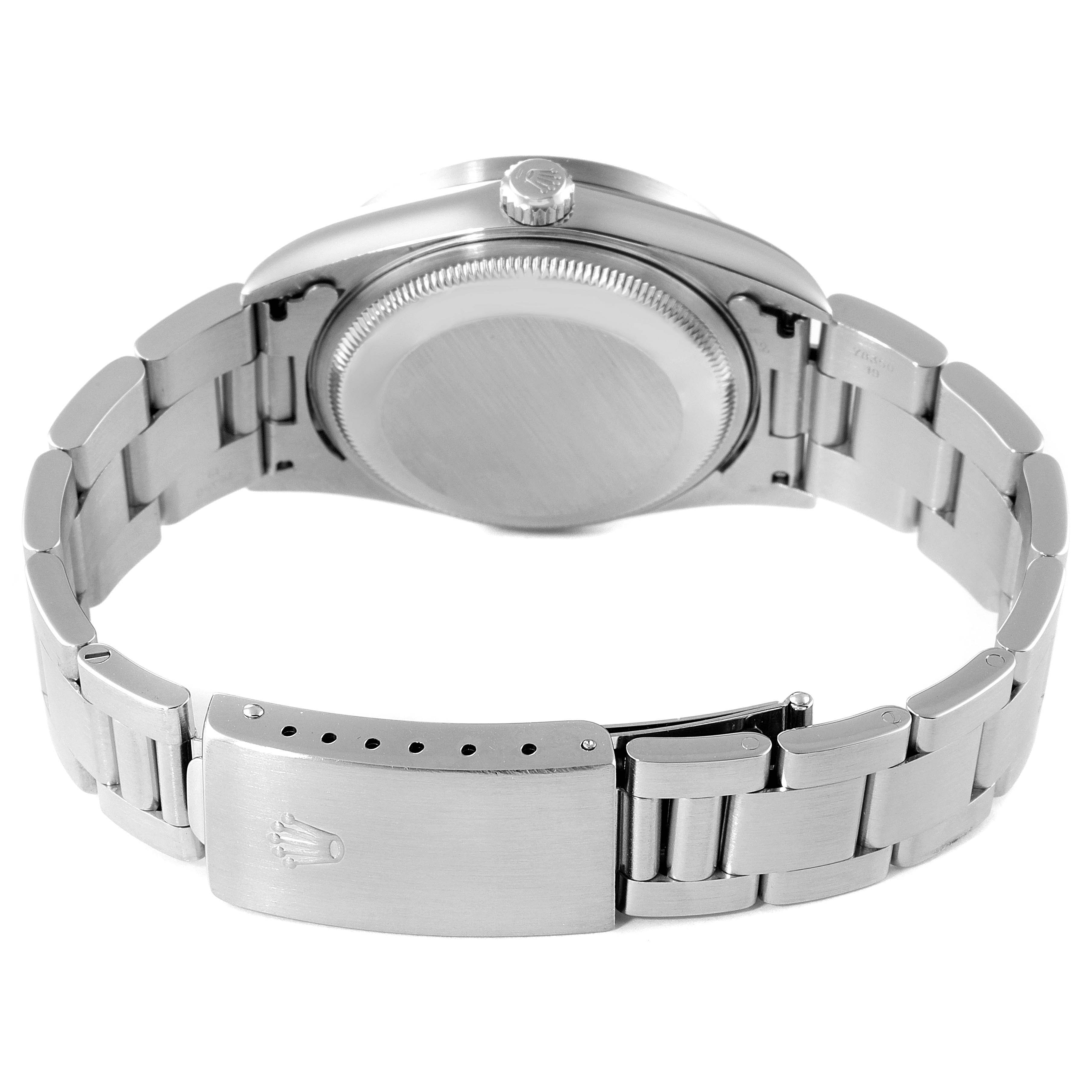 This image shows the back view of a Rolex Date 15210 Men's Stainless Steel Black Dial 15210 Men's Stainless Steel Black Dial model watch, highlighting the case back and metal bracelet with clasp.