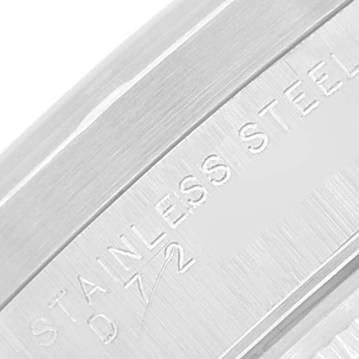 This close-up image shows the detailed engraving on the stainless steel case of the Rolex Date 15210 Men's Stainless Steel Silver Dial 15210 Men's Stainless Steel Silver Dial model watch.