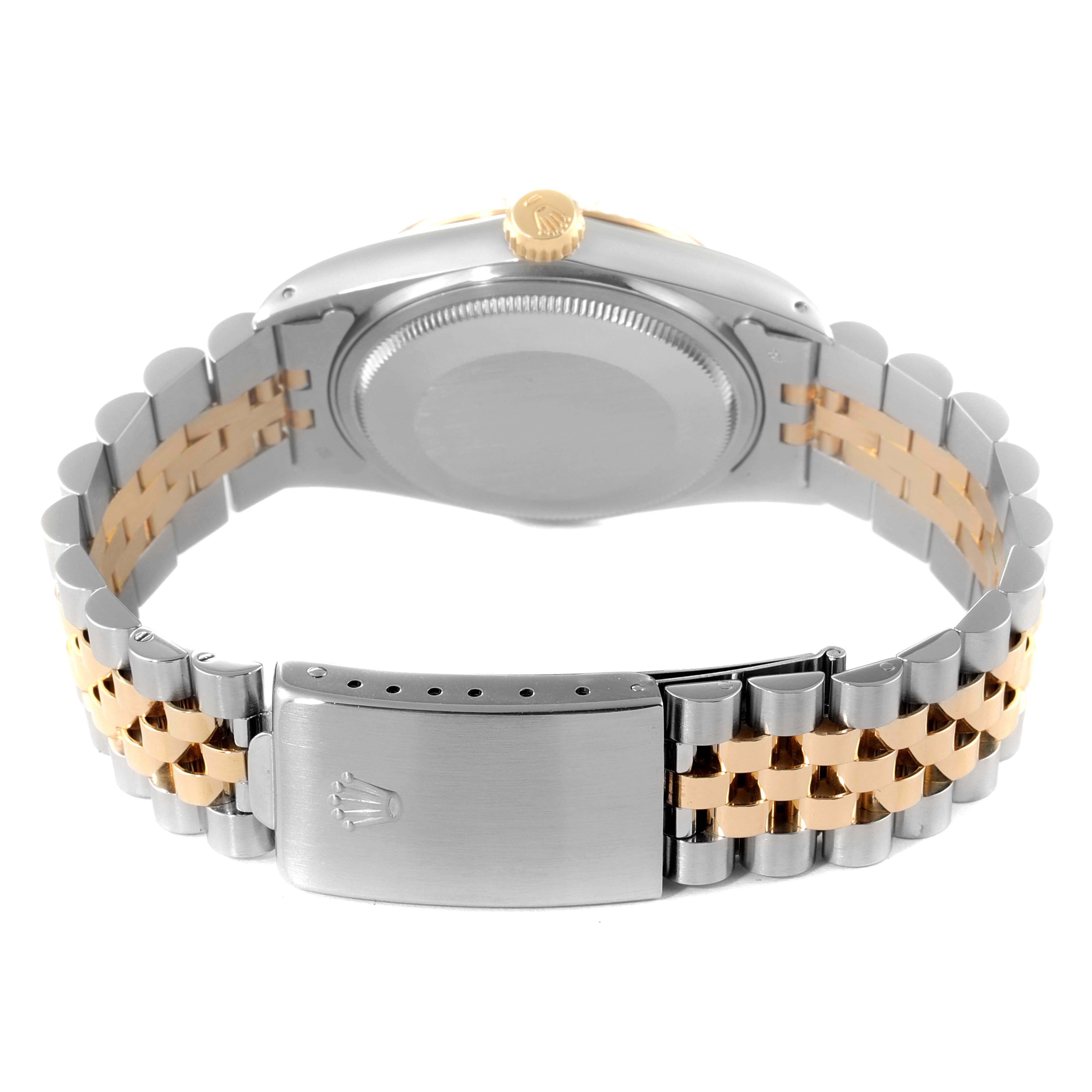 This image of a Rolex Datejust 16013 Men
s Steel and Gold (two tone) Champagne Dial 16013 Men
s Steel and Gold (two tone) Champagne Dial watch shows the back case, crown, and two-tone Jubilee bracelet from a rear angle.