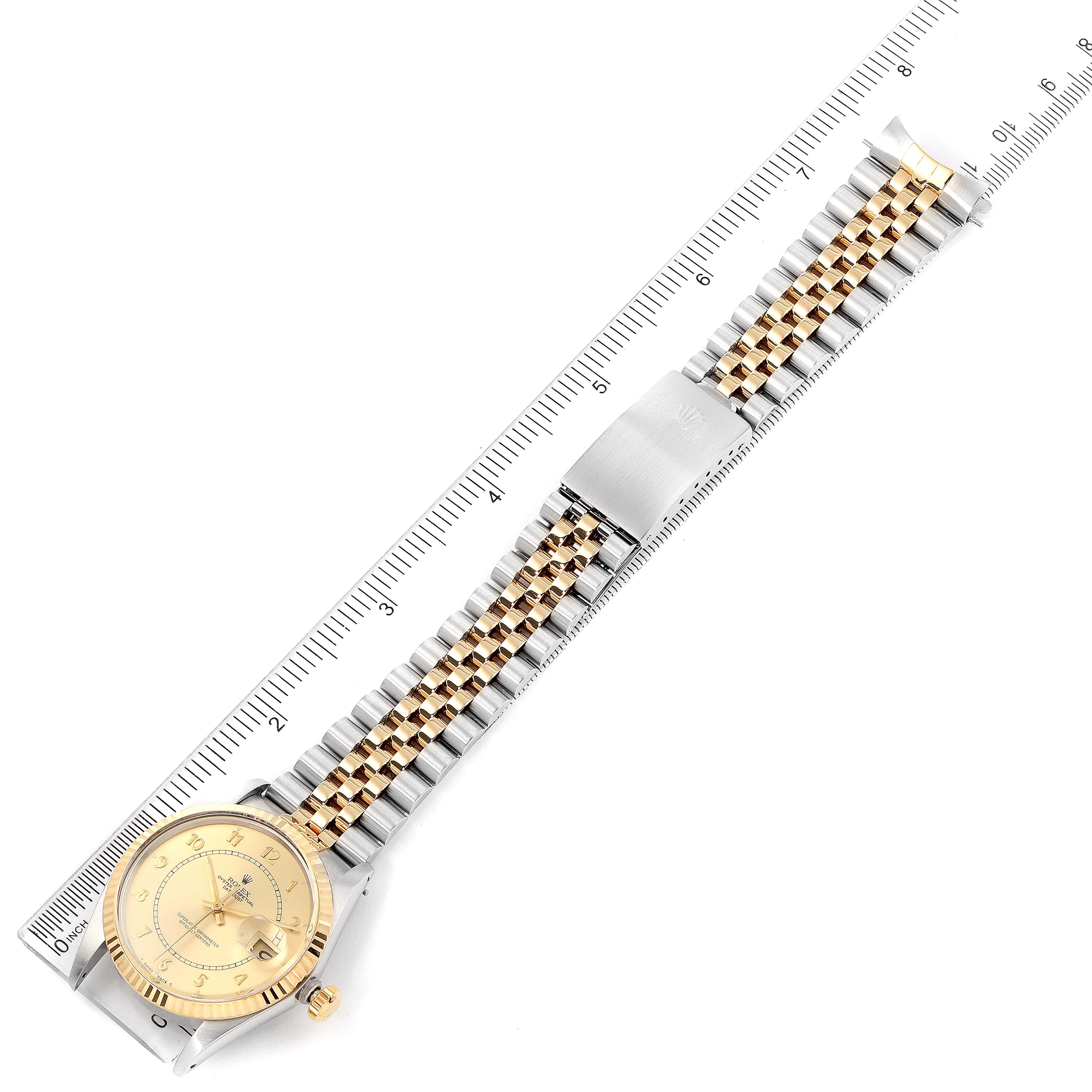 The Vintage Collection Rolex watch is shown from the top, displaying the face, bezel, crown, and bracelet next to a ruler.
