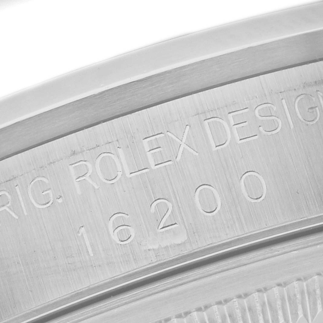 This image shows a close-up of the engraved model number on the case of a Rolex Datejust 16200 Men's Stainless Steel Black Dial 16200 Men's Stainless Steel Black Dial watch.