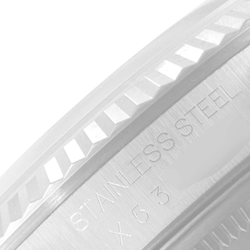 This image shows a close-up of the stainless steel bezel and part of the case of a Rolex Datejust 16234 Men's Stainless Steel Silver Dial 16234 Men's Stainless Steel Silver Dial watch.