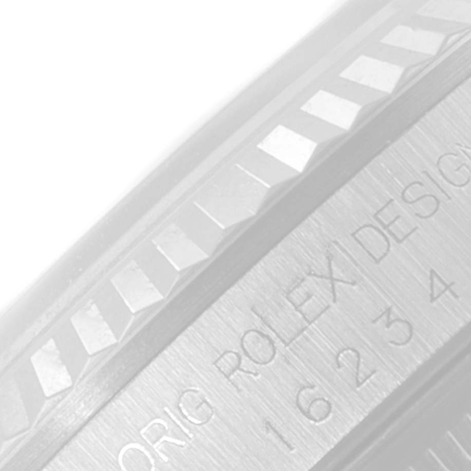 The image shows a close-up of the bezel and engraved text on the case of a Rolex Datejust 16234 Men's Stainless Steel Silver Dial 16234 Men's Stainless Steel Silver Dial watch.