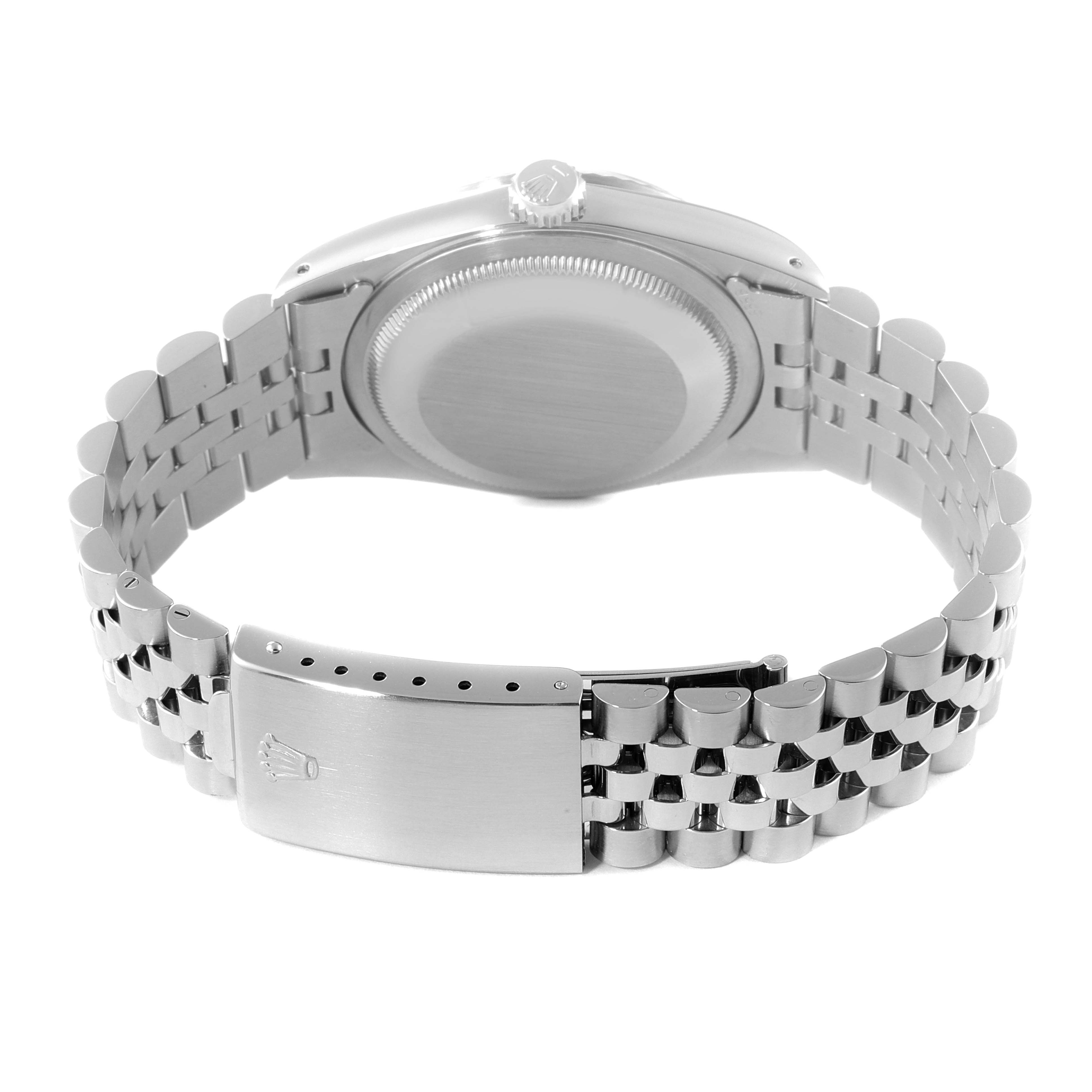 This is a rear view of the Rolex Datejust 16234 Men's Stainless Steel Silver Dial 16234 Men's Stainless Steel Silver Dial watch showing the case back and stainless-steel bracelet with a clasp.