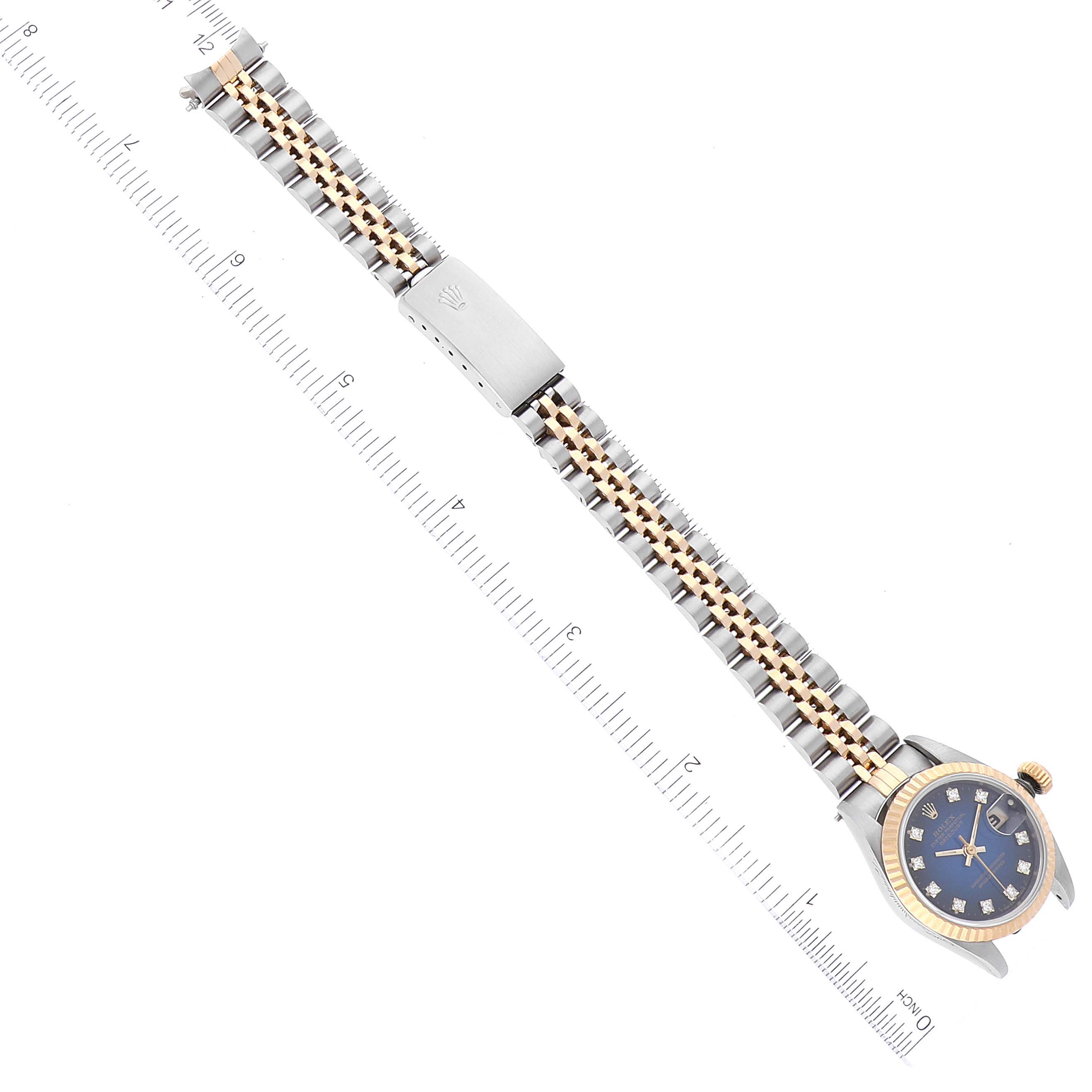 The image shows a Rolex Datejust 69173 Women's Steel and Gold (two tone) Blue Dial 69173 Women's Steel and Gold (two tone) Blue Dial watch from a top-down angle, highlighting the face, bezel, bracelet, and clasp.