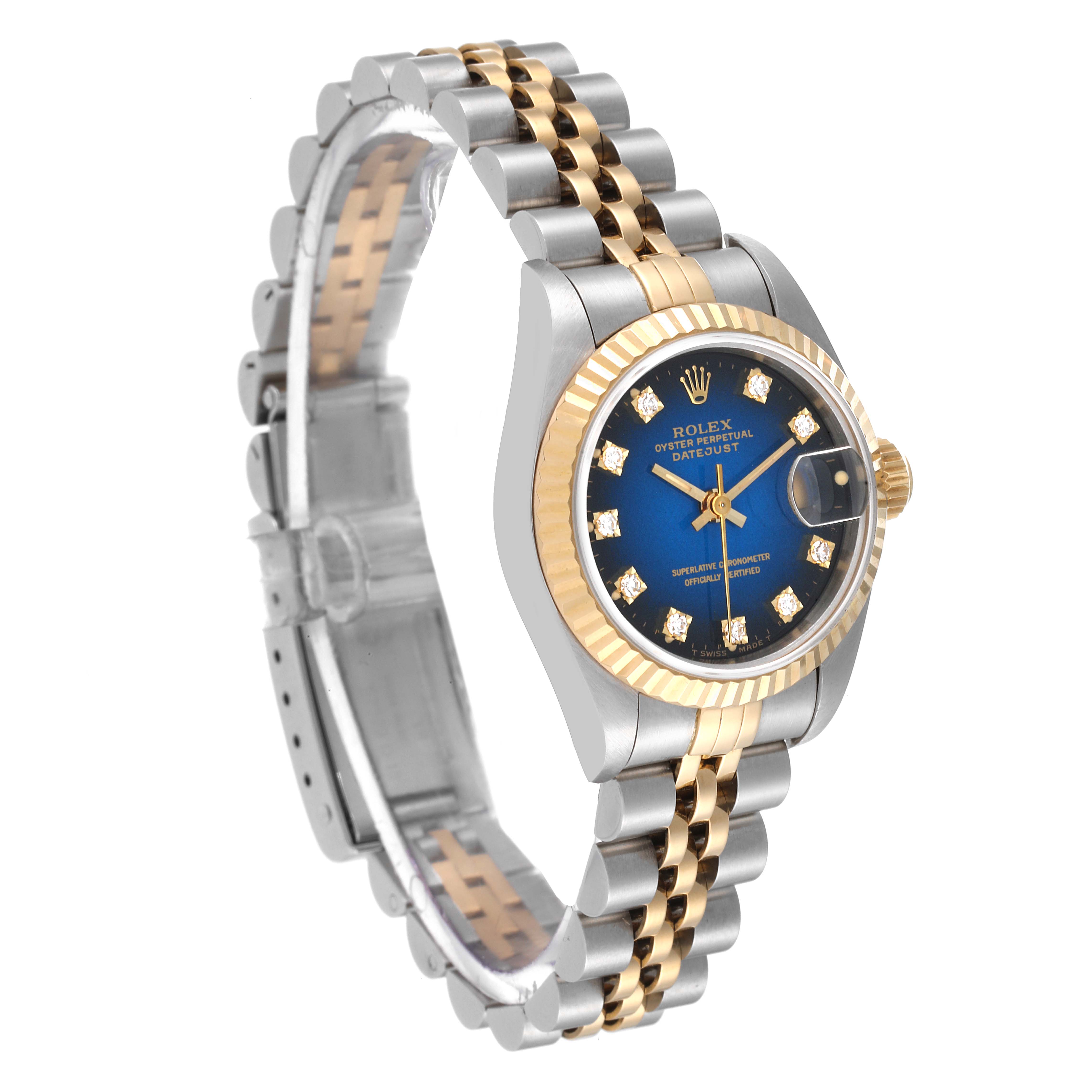 The image shows a Rolex Datejust 69173 Women's Steel and Gold (two tone) Blue Dial 69173 Women's Steel and Gold (two tone) Blue Dial watch from an angled side view, highlighting its two-tone bracelet, fluted bezel, and blue dial with diamond markers.