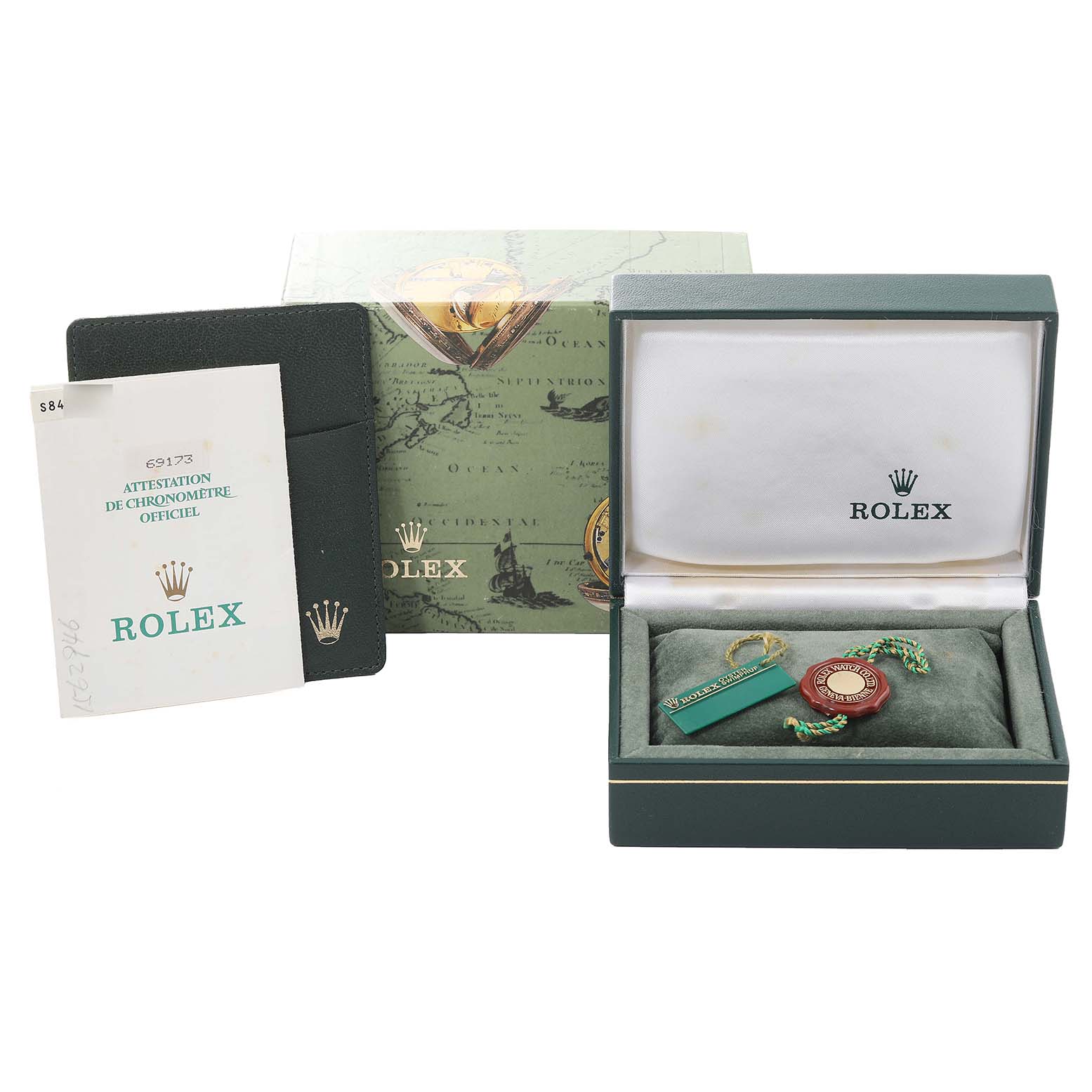 This image shows the packaging, booklet, and tags for a Rolex Datejust 69173 Women's Steel and Gold (two tone) Blue Dial 69173 Women's Steel and Gold (two tone) Blue Dial watch, but not the watch itself, all viewed from the front.