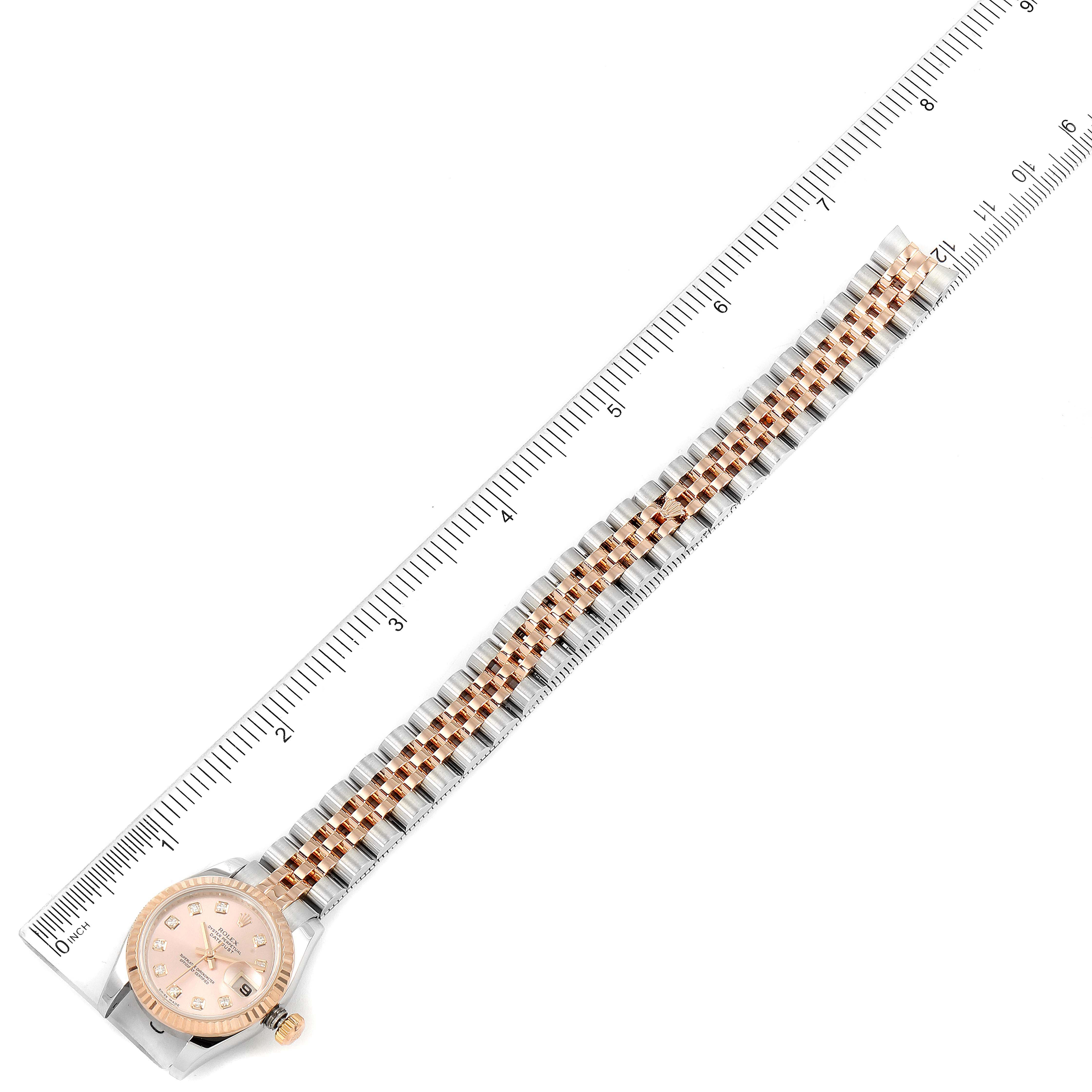 The image shows a Rolex Datejust 179171 Women's Rose Gold Pink Dial 179171 Women's Rose Gold Pink Dial watch laid flat with its bracelet and caseback visible, aligned next to a ruler.