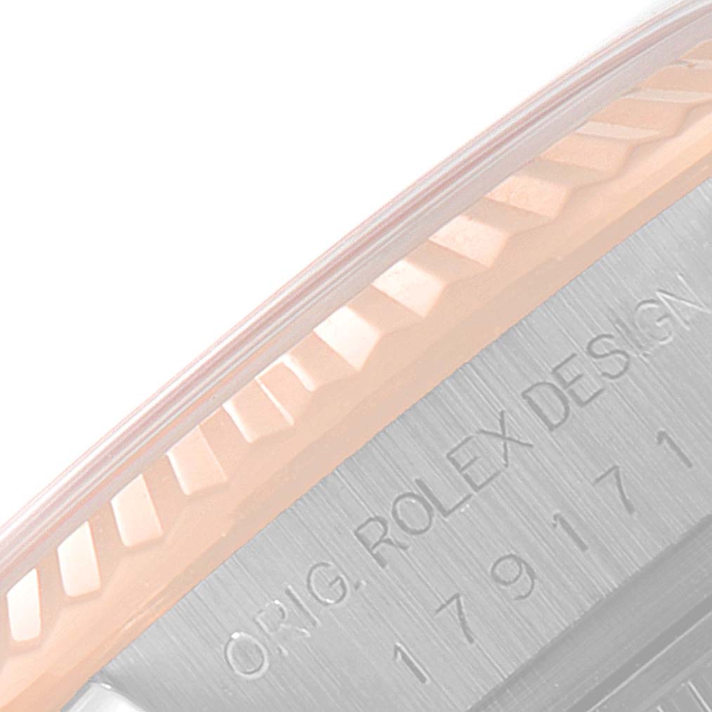 The image shows a close-up of the engraved side of the Rolex Datejust 179171 Women's Steel and Gold (two tone) Mother of Pearl Dial 179171 Women's Steel and Gold (two tone) Mother of Pearl Dial watch, highlighting the bezel and part of the case.