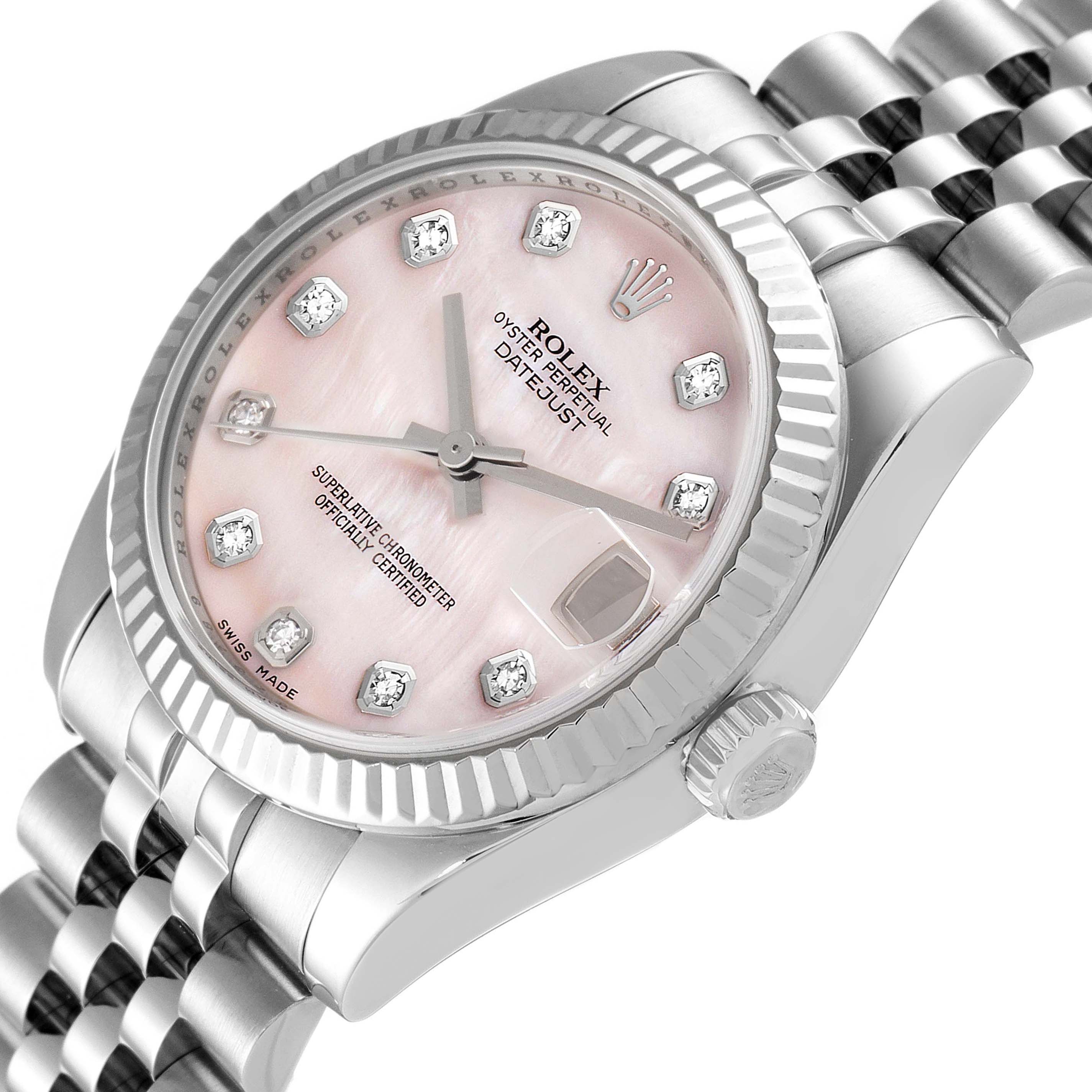 The Rolex Mid-Size 178274 Women
s Stainless Steel Mother of Pearl Dial 178274 Women
s Stainless Steel Mother of Pearl Dial watch is shown in a close-up side angle, highlighting its pink dial, date display, and fluted bezel.