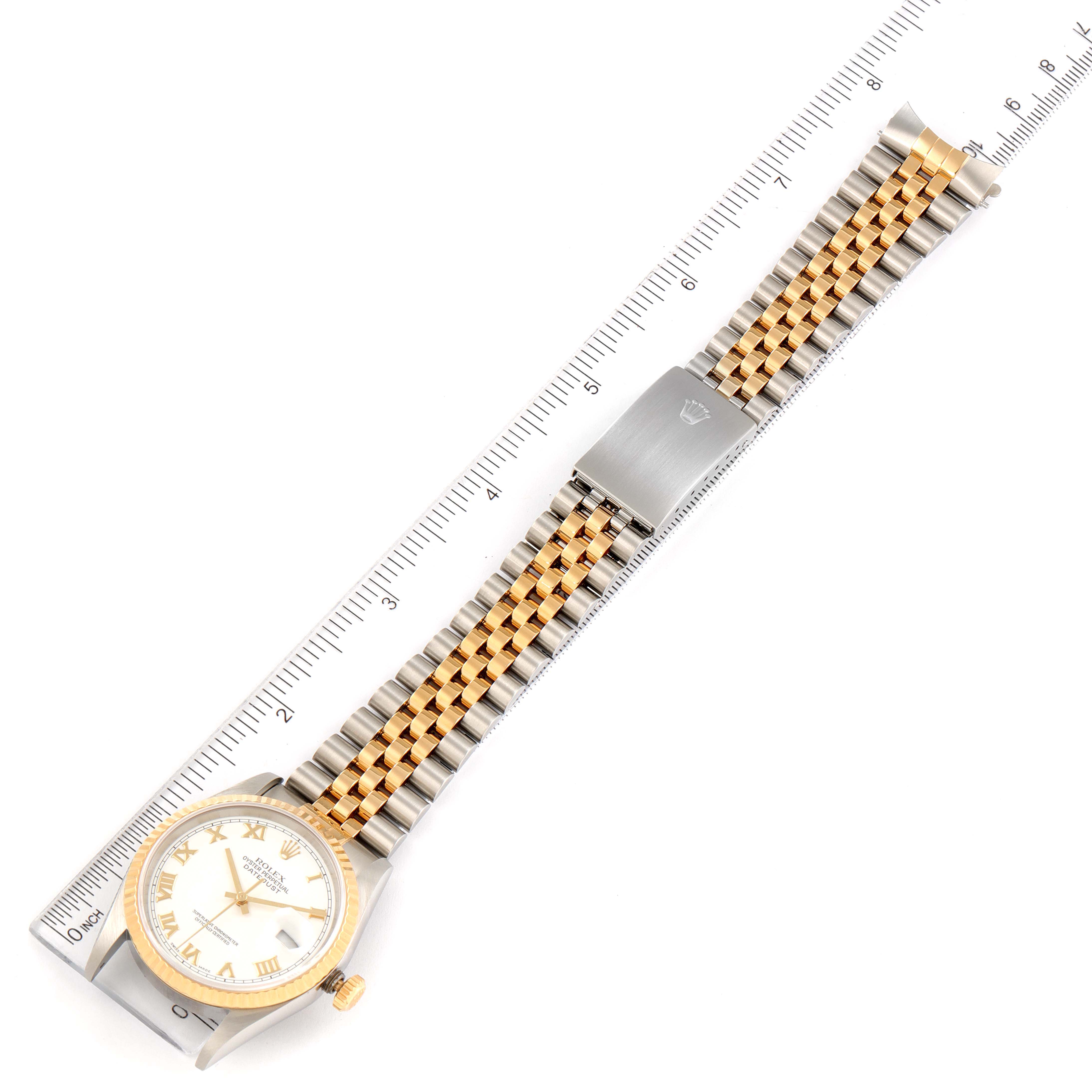 This image shows a Rolex Datejust 16233 Men's Steel and Gold (two tone) White Dial 16233 Men's Steel and Gold (two tone) White Dial watch from a top-down angle, highlighting its dial, bracelet, and clasp.