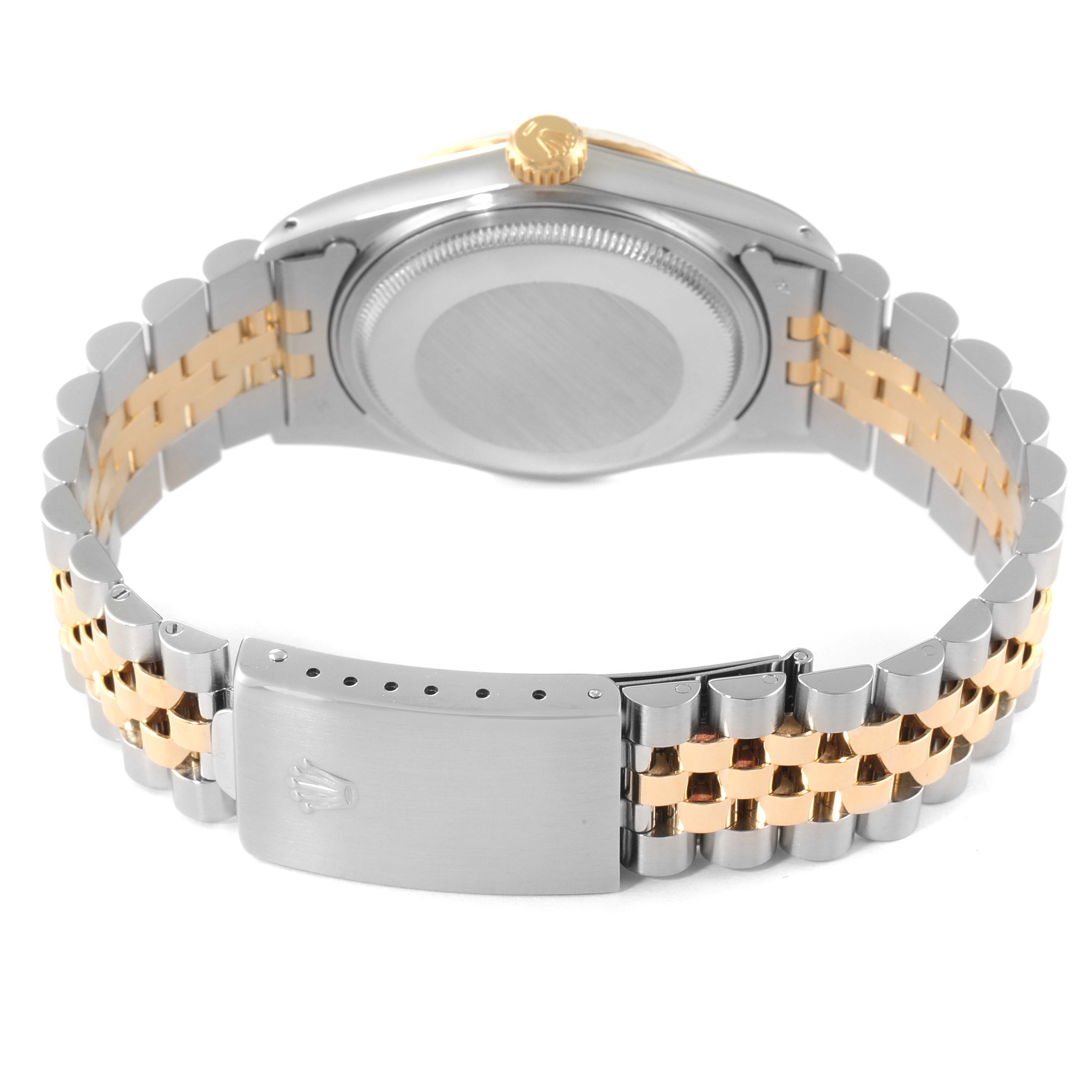 The image shows the back of the case and bracelet clasp of a Rolex Datejust 16013 Men
s Steel and Gold (two tone) Champagne Dial 16013 Men
s Steel and Gold (two tone) Champagne Dial watch, featuring a two-tone metal design.