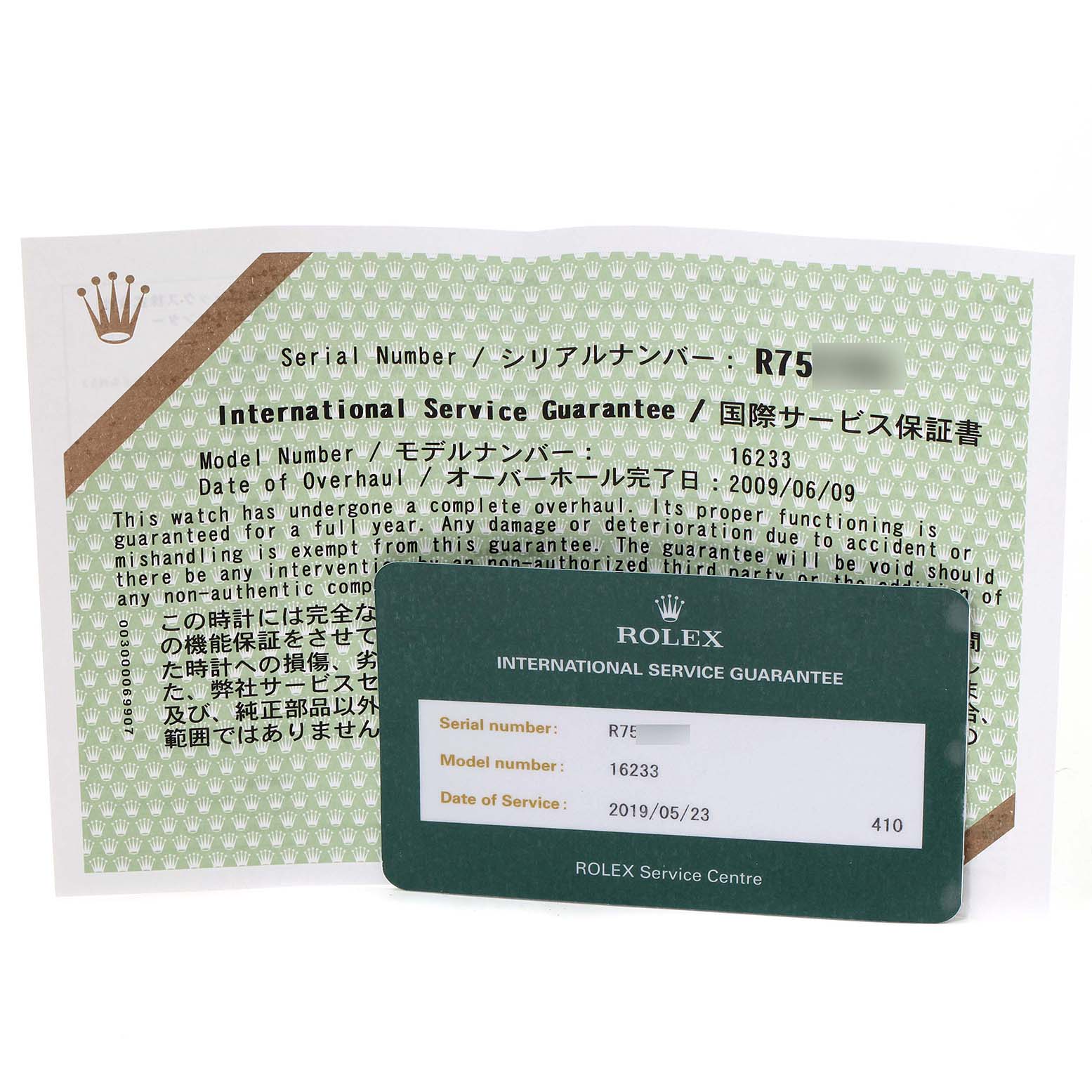 The image shows the front of a green Rolex International Service Guarantee card and its accompanying document for a Datejust model.