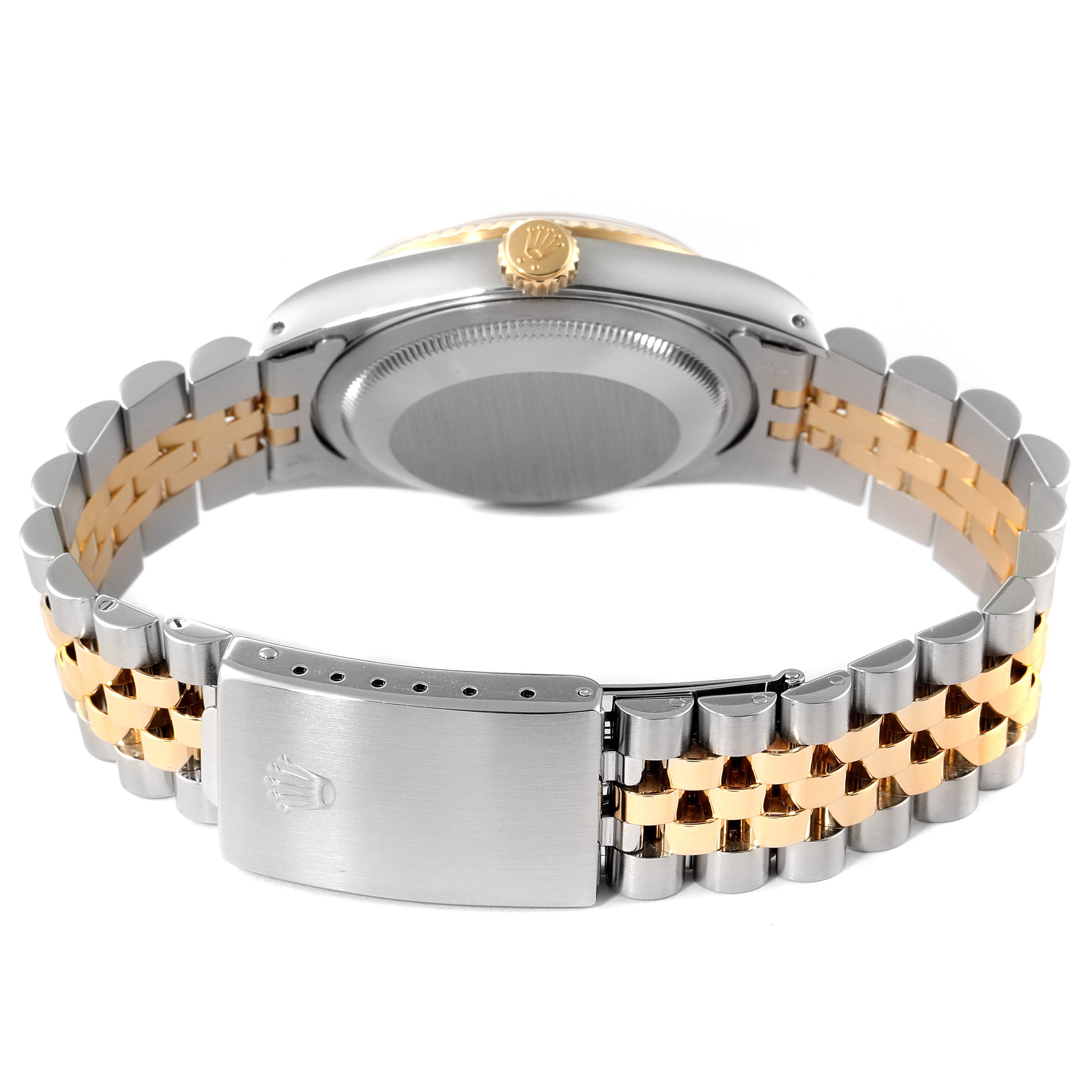 This image shows the back and clasp of a Rolex Datejust 16233 Men's Steel and Gold (two tone) Blue Dial 16233 Men's Steel and Gold (two tone) Blue Dial watch, highlighting its two-tone bracelet and crown.