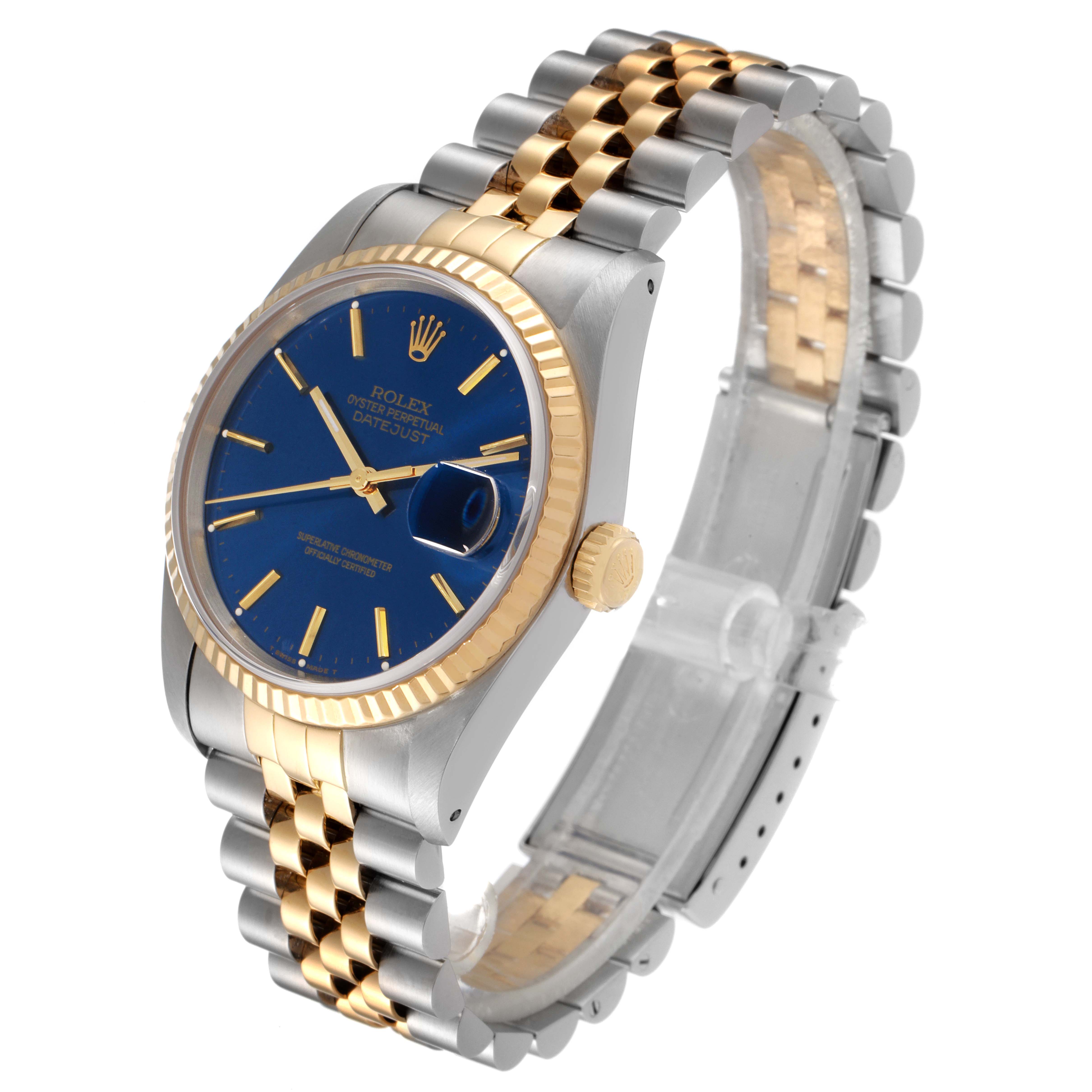 The image shows a Rolex Datejust 16233 Men's Steel and Gold (two tone) Blue Dial 16233 Men's Steel and Gold (two tone) Blue Dial watch at a slight angle, displaying its blue dial, jubilee bracelet, and fluted bezel.