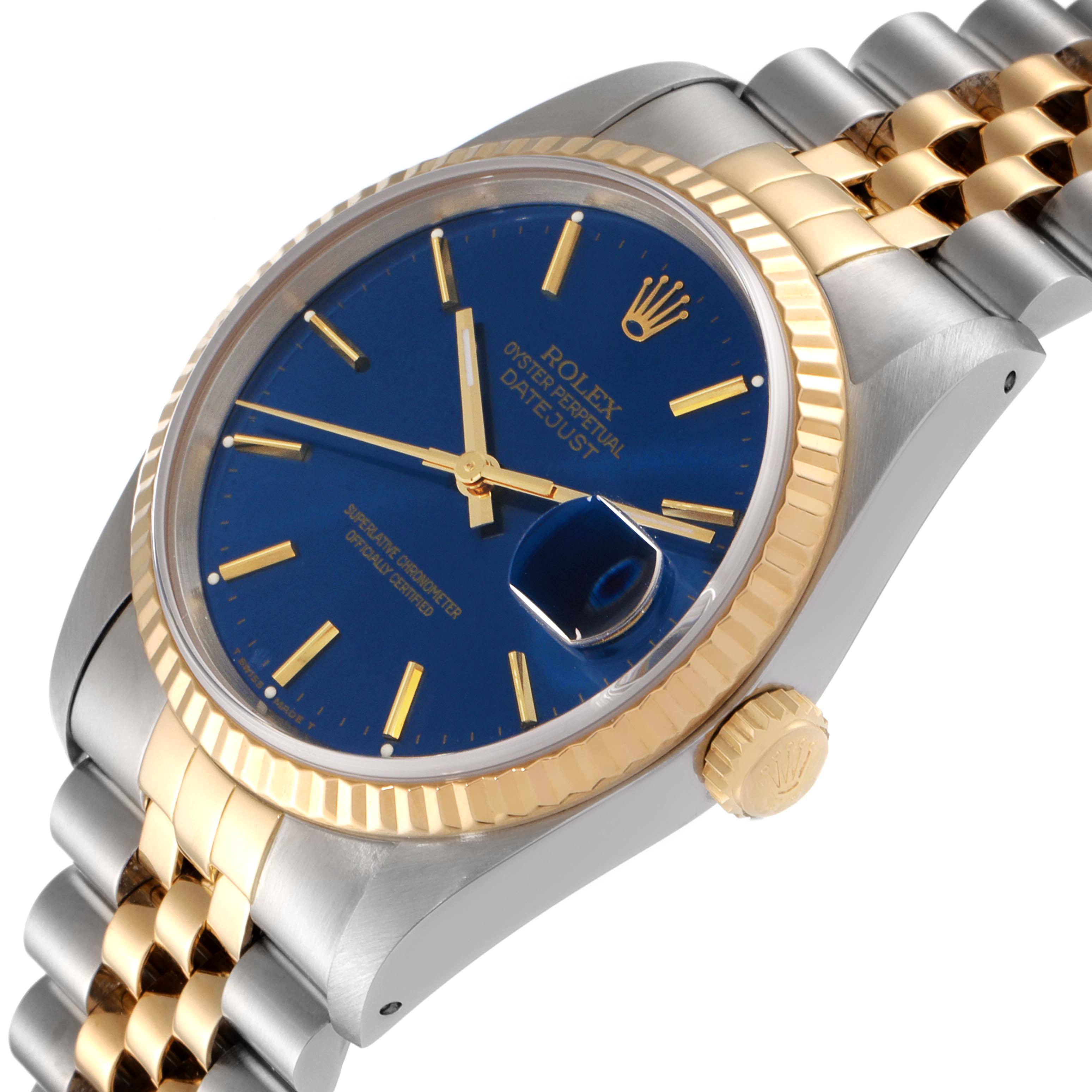 The image shows a Rolex Datejust 16233 Men's Steel and Gold (two tone) Blue Dial 16233 Men's Steel and Gold (two tone) Blue Dial watch at a slight angle, highlighting the blue dial, gold bezel, crown, and two-tone bracelet.
