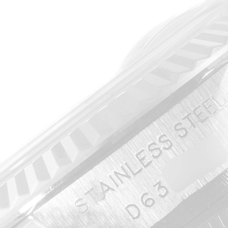 The image shows a close-up view of the engraving on the case side of a Rolex Datejust 179174 Women's Stainless Steel Pink Dial 179174 Women's Stainless Steel Pink Dial, highlighting the "STAINLESS STEEL" text.