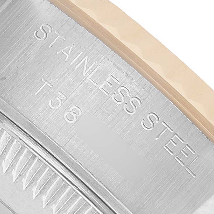 The image shows a close-up of the stainless steel bezel with engravings of a Rolex Datejust 69173 Women's Steel and Gold (two tone) Black Dial watch.