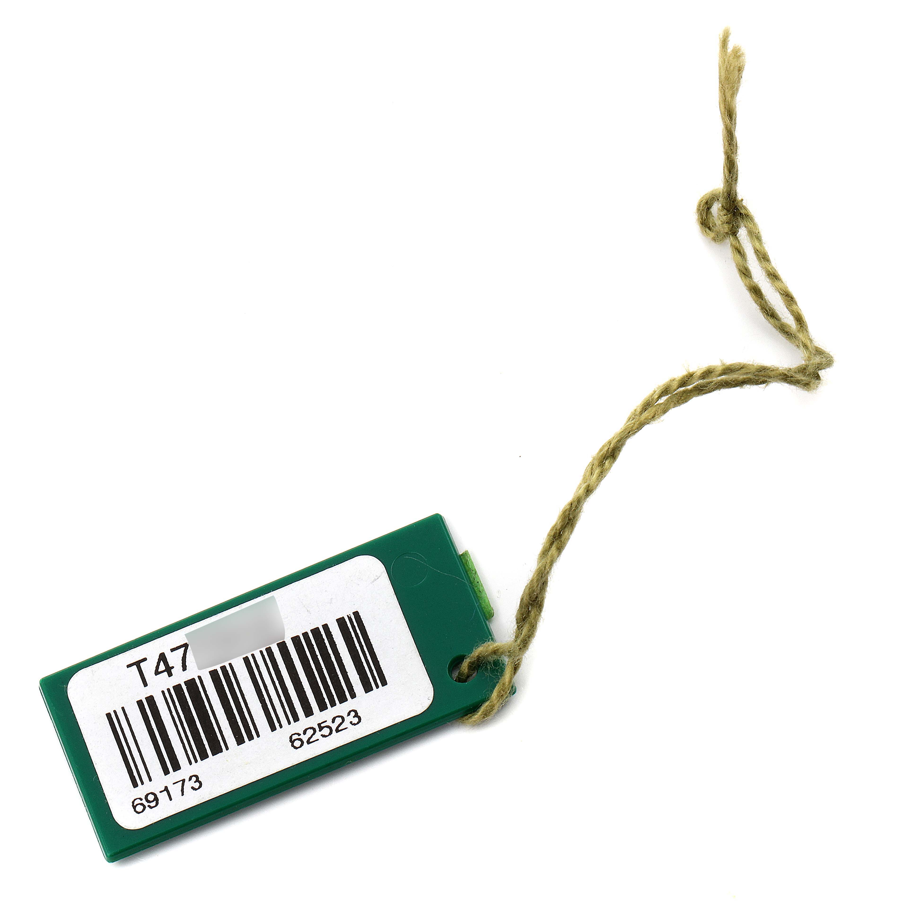 This image shows a green tag with a barcode and string, which is likely an accessory for the Rolex Datejust 69173 Women's Steel and Gold (two tone) Black Dial 69173 Women's Steel and Gold (two tone) Black Dial watch model.