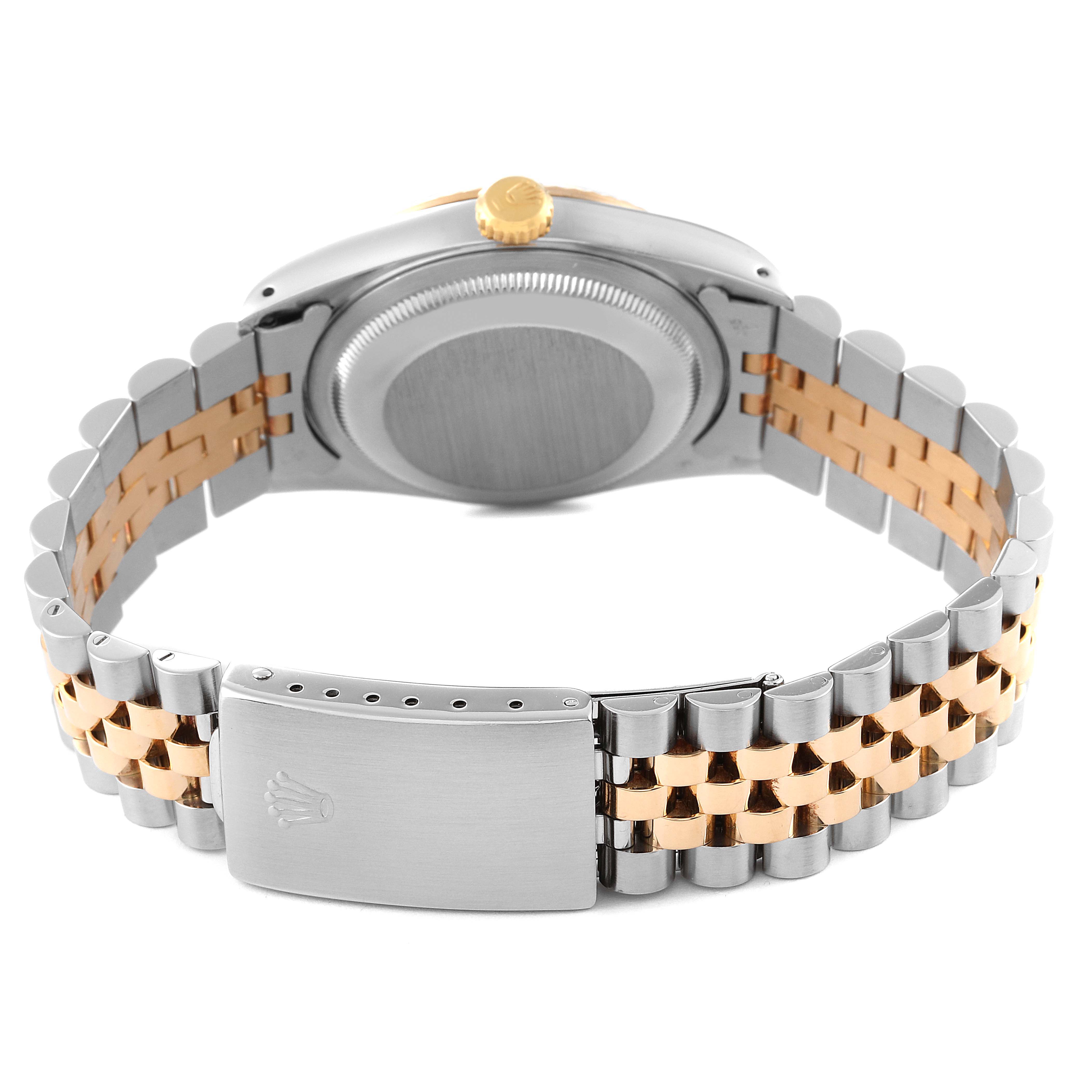 This image shows the back case and clasp of the Rolex Datejust 16233 Men's Steel and Gold (two tone) Champagne Dial 16233 Men's Steel and Gold (two tone) Champagne Dial watch with a two-tone bracelet.