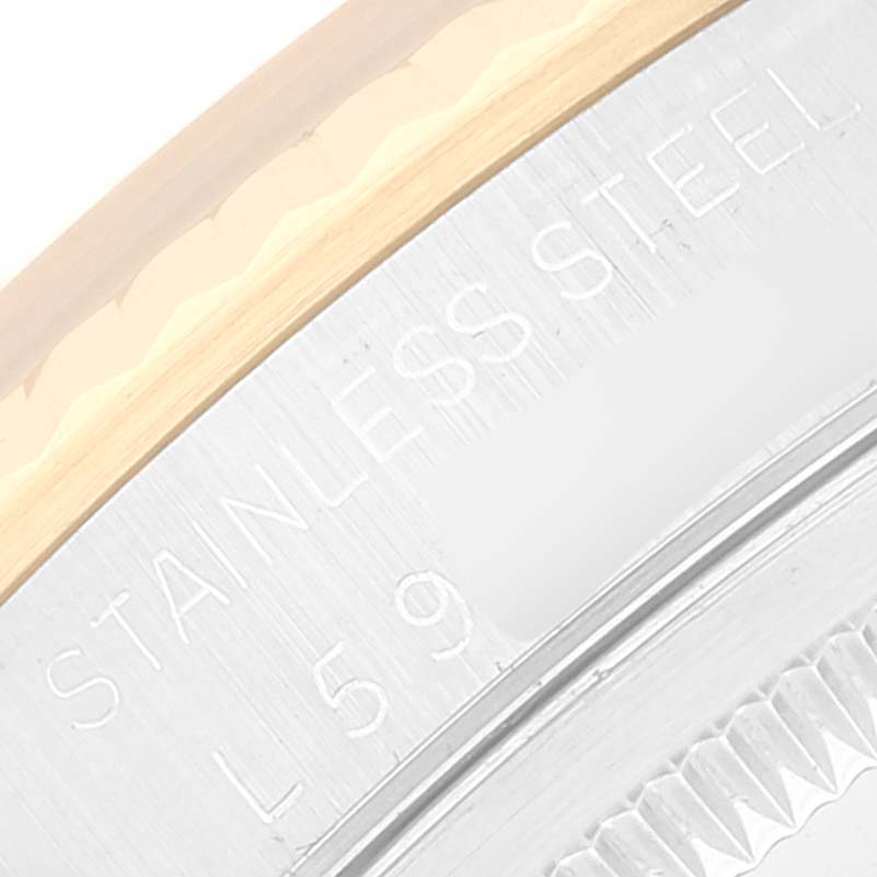 The image shows a close-up of the stainless steel casing and bezel of a Rolex Datejust 16233 Men's Steel and Gold (two tone) Champagne Dial 16233 Men's Steel and Gold (two tone) Champagne Dial watch.