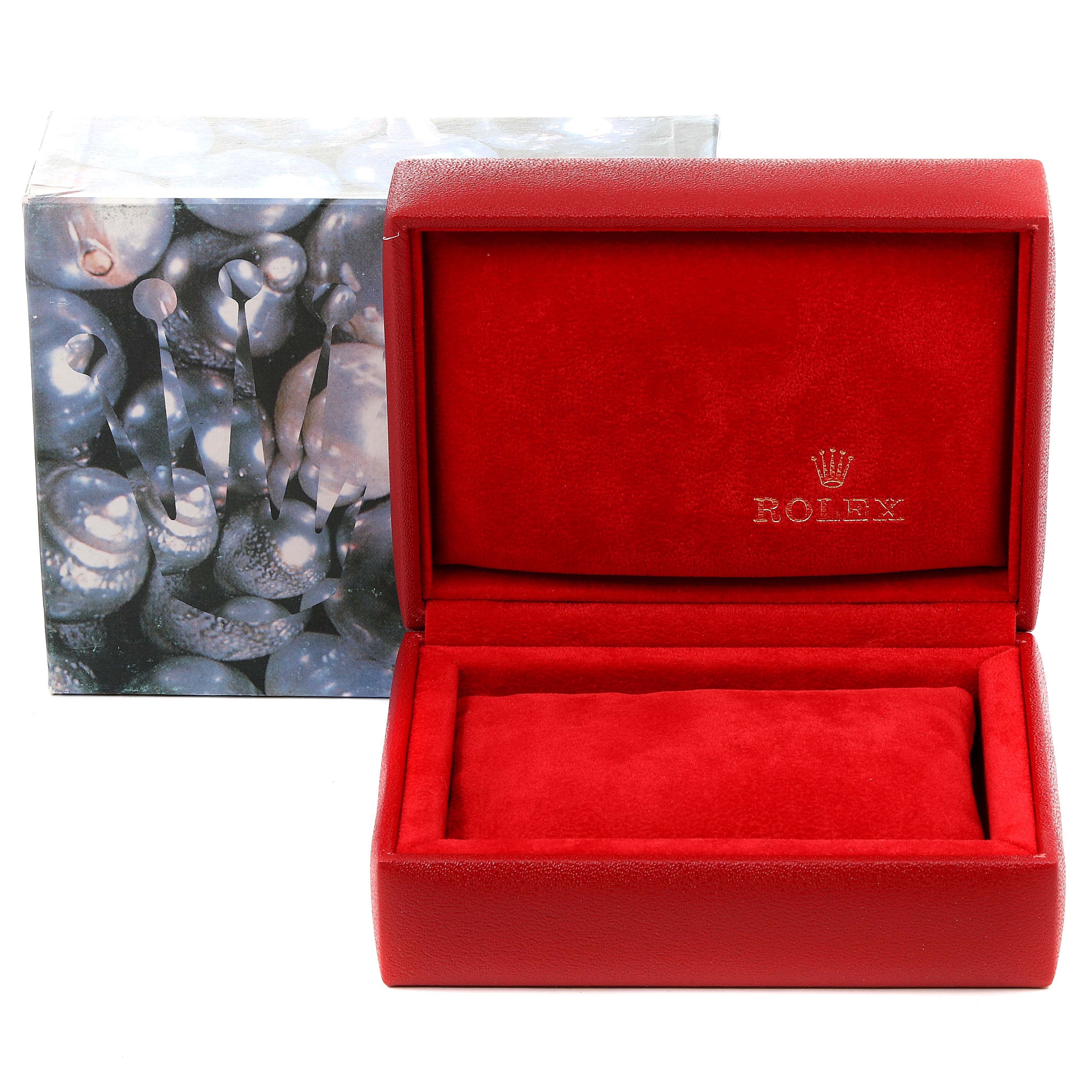 This image shows an open Rolex Datejust 79173 Women's Steel and Gold (two tone) Champagne Dial 79173 Women's Steel and Gold (two tone) Champagne Dial watch box with a red interior and packaging featuring the Rolex logo.