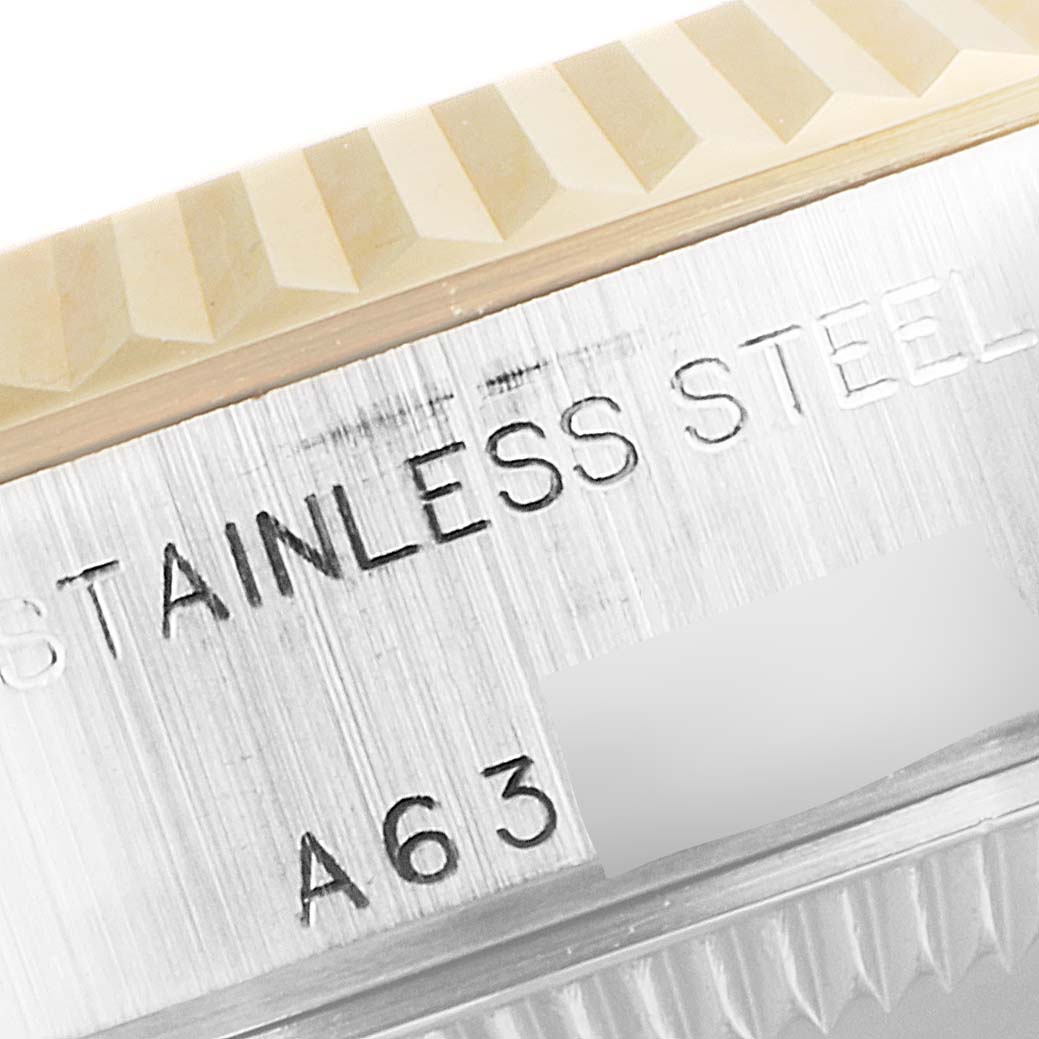 This is a close-up of the bezel and side of the stainless steel case of a Rolex Datejust 79173 Women's Steel and Gold (two tone) Champagne Dial 79173 Women's Steel and Gold (two tone) Champagne Dial watch.