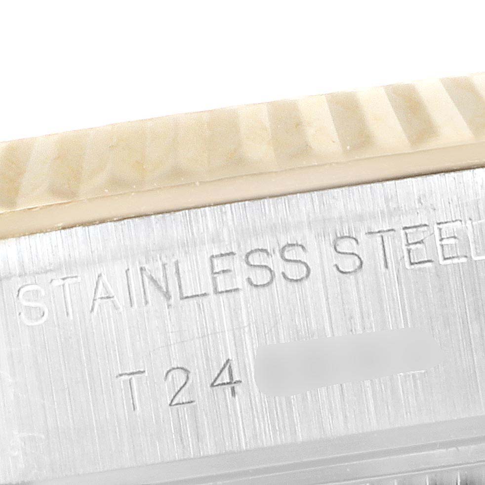 This image shows a close-up of the Stainless Steel marking on the side of a Rolex Datejust 69173 Women's Steel and Gold (two tone) Beige Dial 69173 Women's Steel and Gold (two tone) Beige Dial watch case.