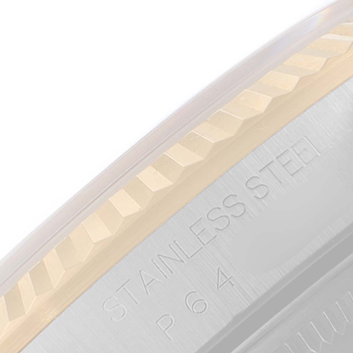 The image shows a side angle of the bezel and part of the case back with "STAINLESS STEEL" engraving on a Rolex Datejust 16233 Men's Steel and Gold (two tone) Beige Dial 16233 Men's Steel and Gold (two tone) Beige Dial.