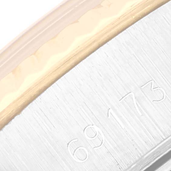 This close-up shows the side edge and reference number "69173" of the Rolex Datejust 69173 Women's Steel and Gold (two tone) Silver Dial 69173 Women's Steel and Gold (two tone) Silver Dial watch case.