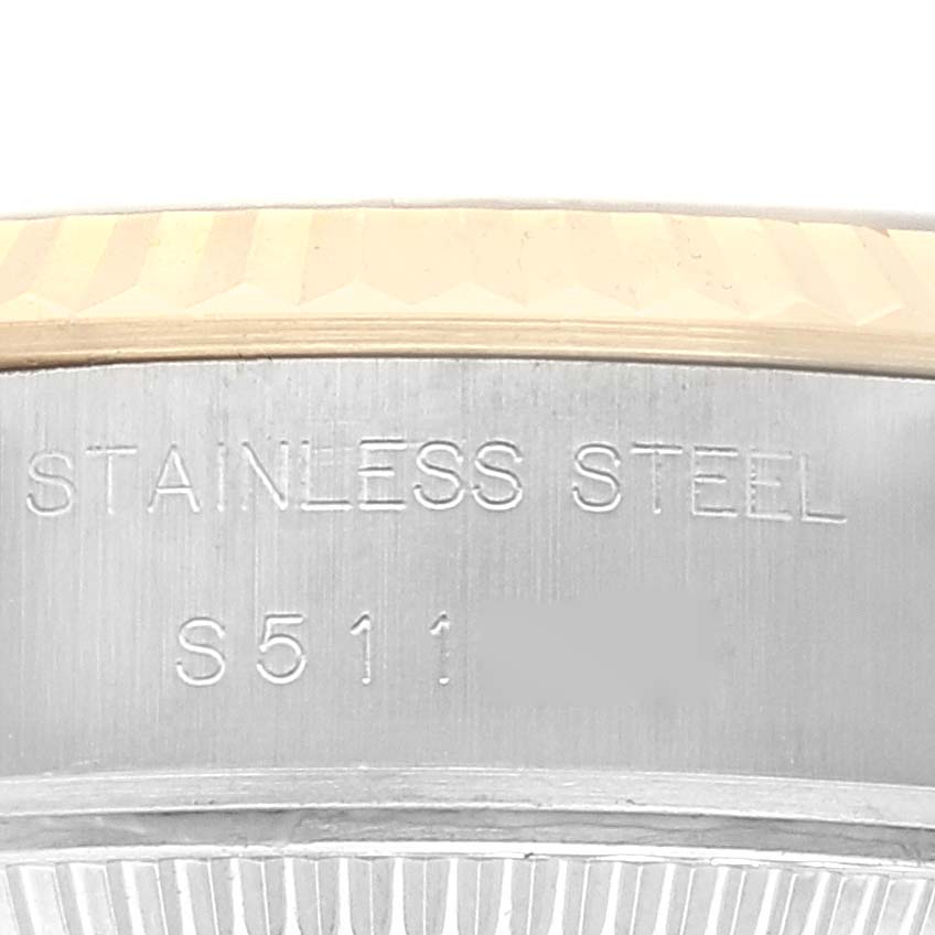 This image shows a close-up view of the stainless steel side casing with engravings on a Rolex Datejust 69173 Women's Steel and Gold (two tone) Grey Dial 69173 Women's Steel and Gold (two tone) Grey Dial watch.