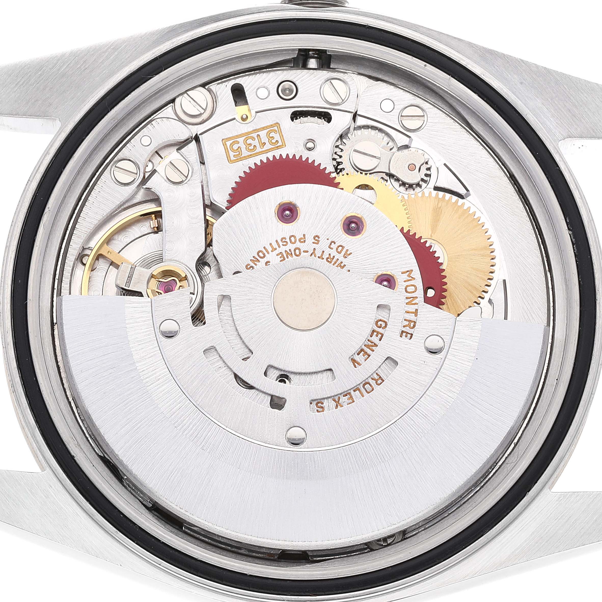 This image shows the internal mechanism of a Rolex Datejust 16233 Men's Steel and Gold (two tone) White Dial 16233 Men's Steel and Gold (two tone) White Dial watch from a back angle with various gears and components visible.
