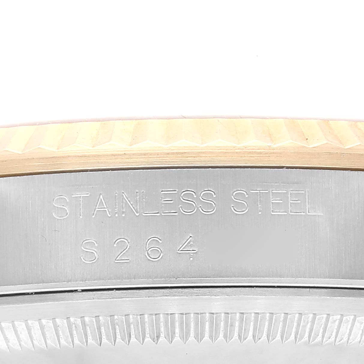 This image shows a close-up of the side of a Rolex Datejust 16233 Men's Steel and Gold (two tone) White Dial 16233 Men's Steel and Gold (two tone) White Dial watch with engraving "Stainless Steel S264."