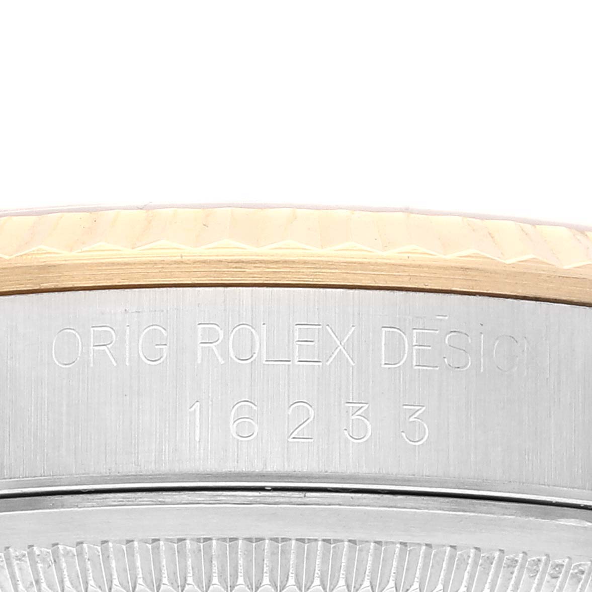 This image shows a close-up of the model number and design engraving on the case of a Rolex Datejust 16233 Men's Steel and Gold (two tone) White Dial 16233 Men's Steel and Gold (two tone) White Dial watch.