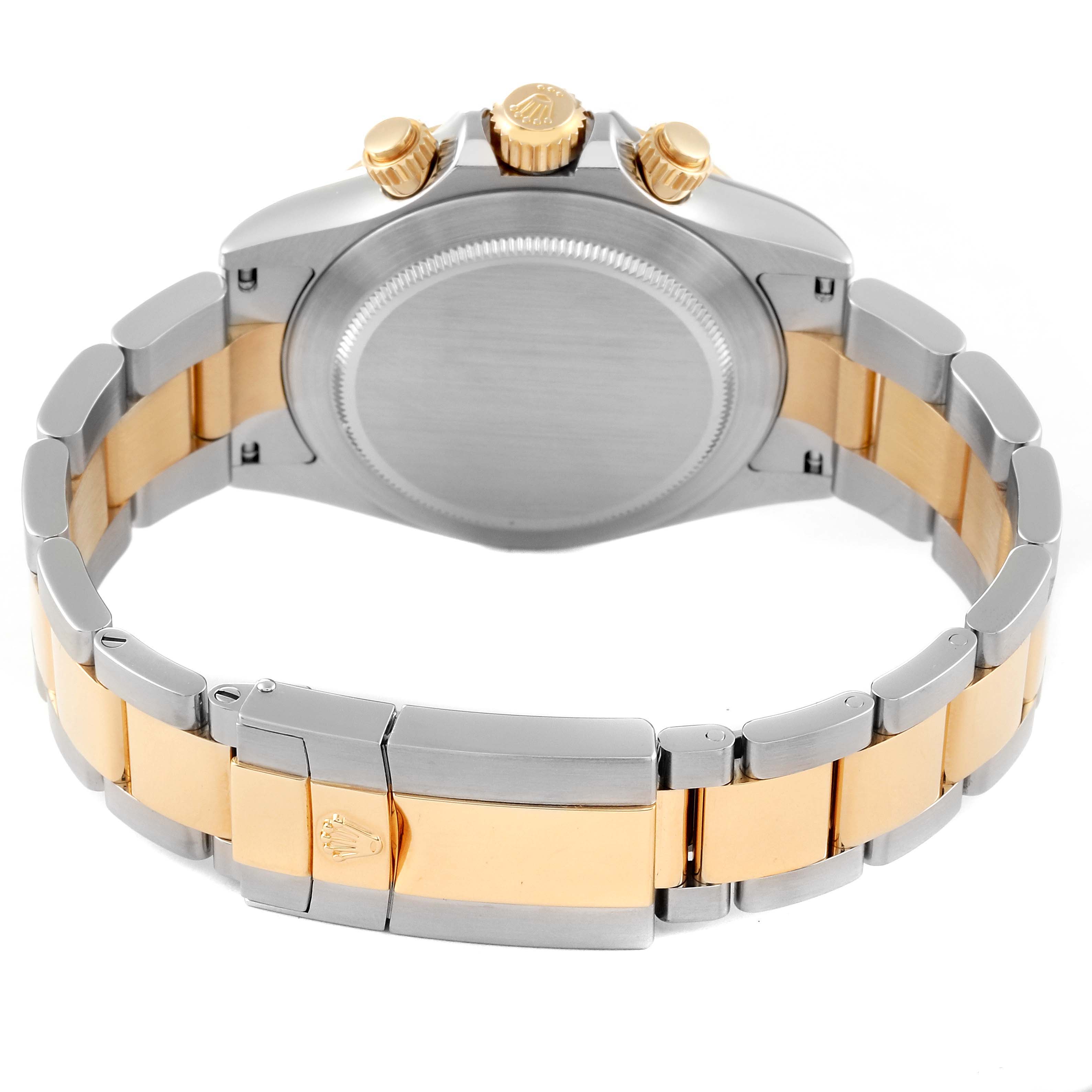 The image shows the back view of a Rolex Daytona 116523 Men's Steel and Gold (two tone) Champagne Dial 116523 Men's Steel and Gold (two tone) Champagne Dial watch showcasing its bracelet and clasp.