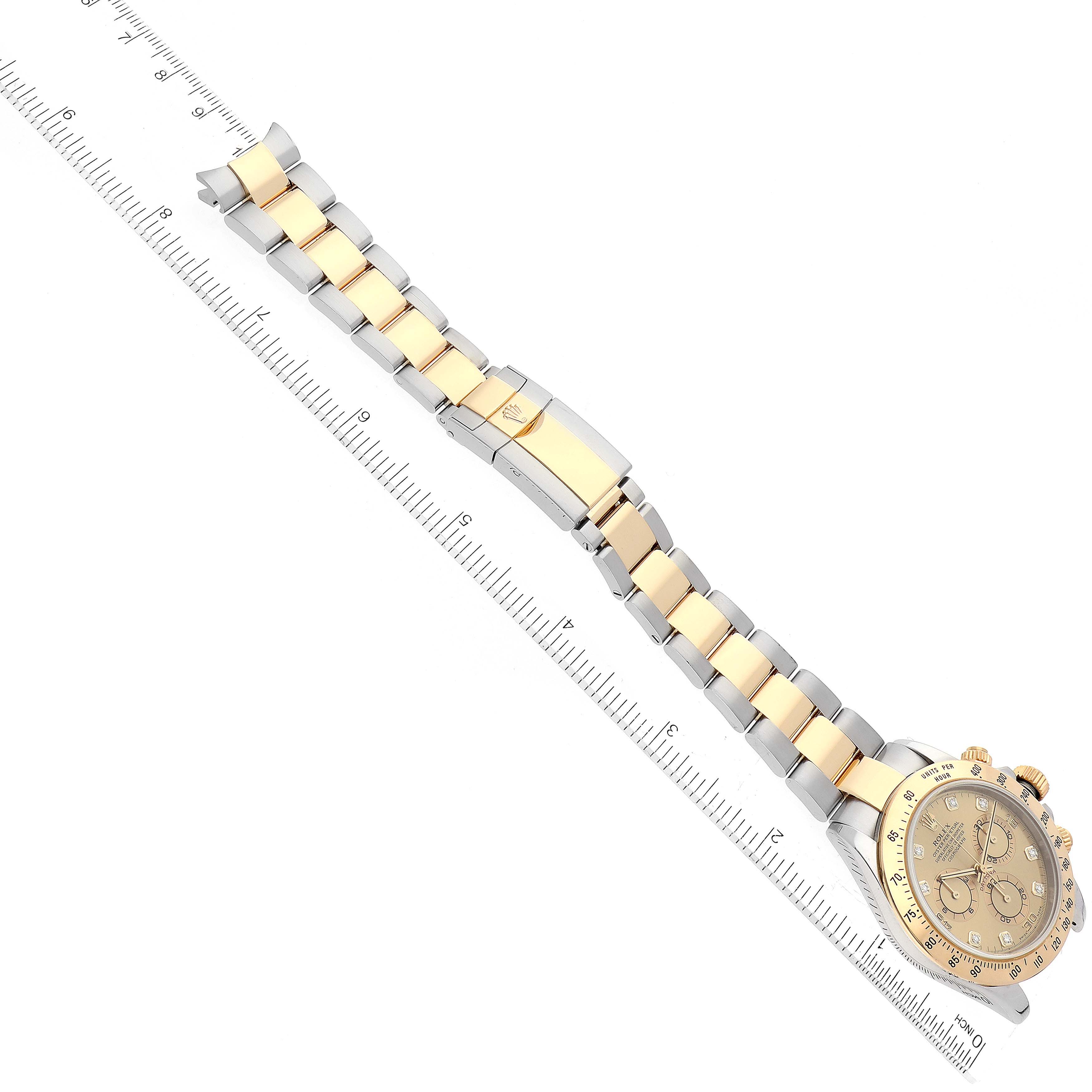 The image shows the Rolex Daytona 116523 Men's Steel and Gold (two tone) Champagne Dial 116523 Men's Steel and Gold (two tone) Champagne Dial watch at an angle, displaying its bracelet length with a ruler for measurement.