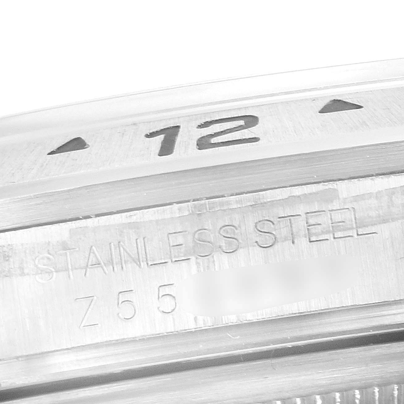 The image shows a close-up view of the stainless steel casing and part of the 12 o'clock marker of a Rolex Explorer 16570 Men's Stainless Steel White Dial 16570 Men's Stainless Steel White Dial watch.