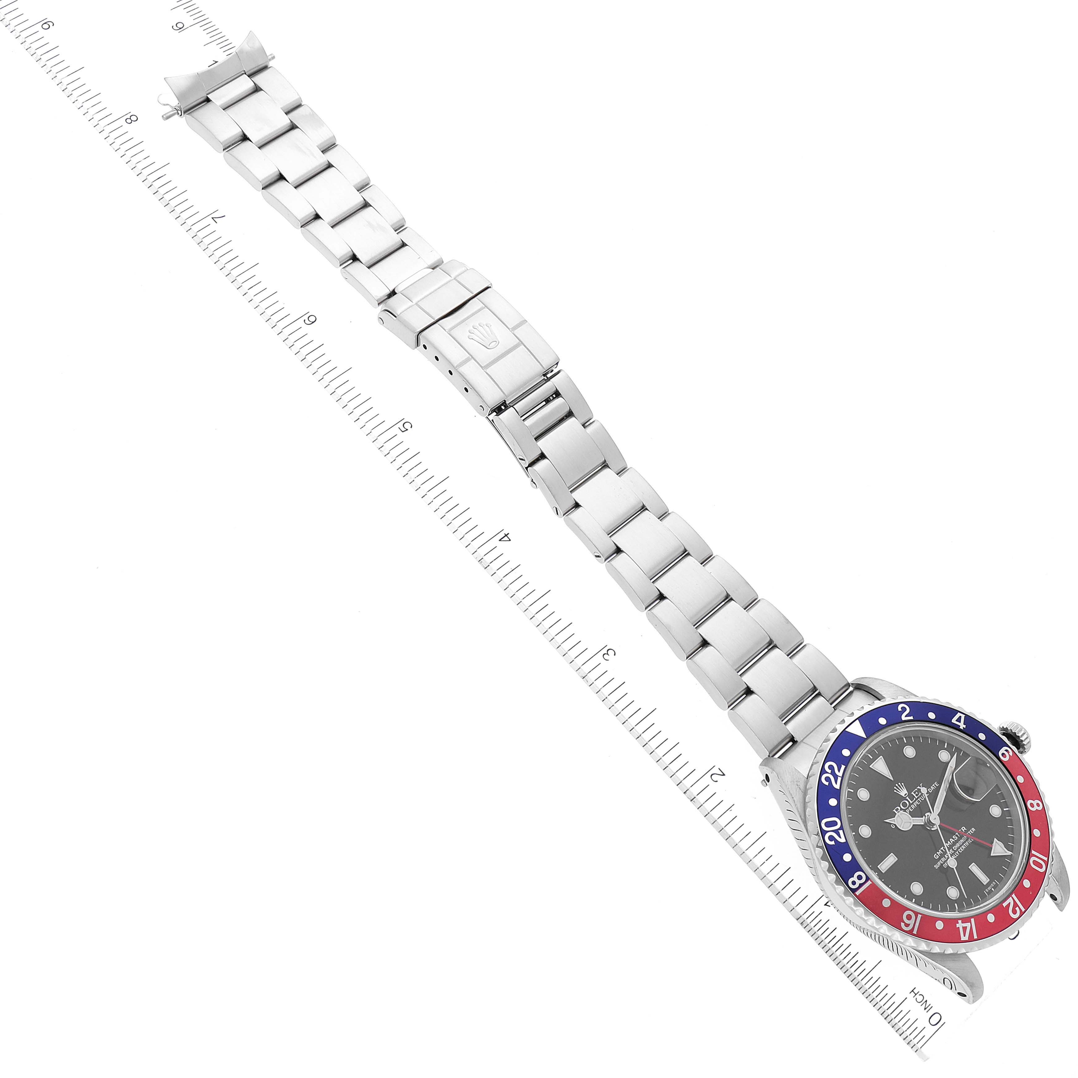 The image shows a top-view angle of a Rolex GMT-Master 16700 Men
s Stainless Steel Black Dial 16700 Men
s Stainless Steel Black Dial watch, with the full metal bracelet and bezel visible.