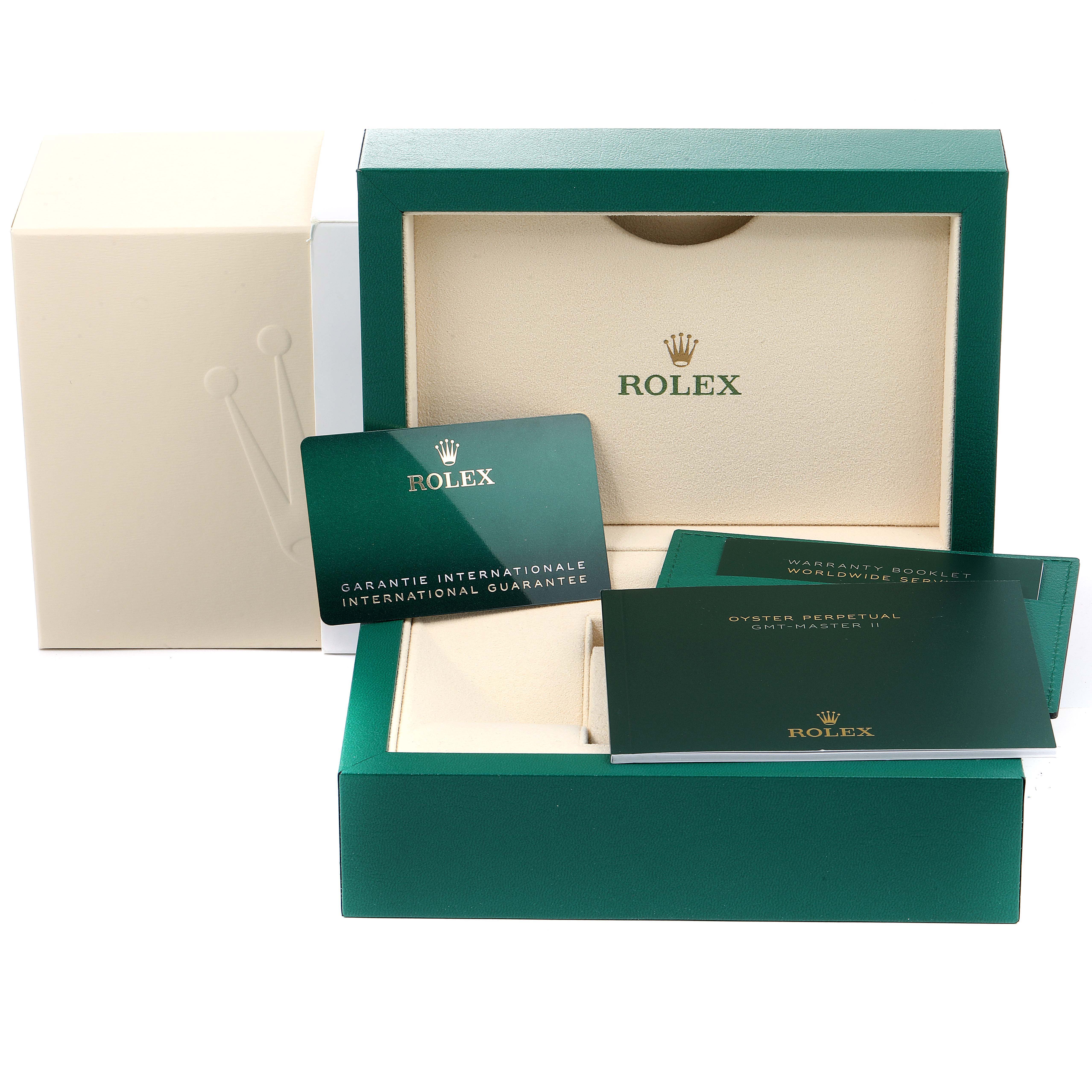 This image shows the packaging and documentation for a Rolex GMT-Master 126710 Men
s Stainless Steel Black Dial 126710 Men
s Stainless Steel Black Dial watch, including the box, warranty booklet, and guarantee card.